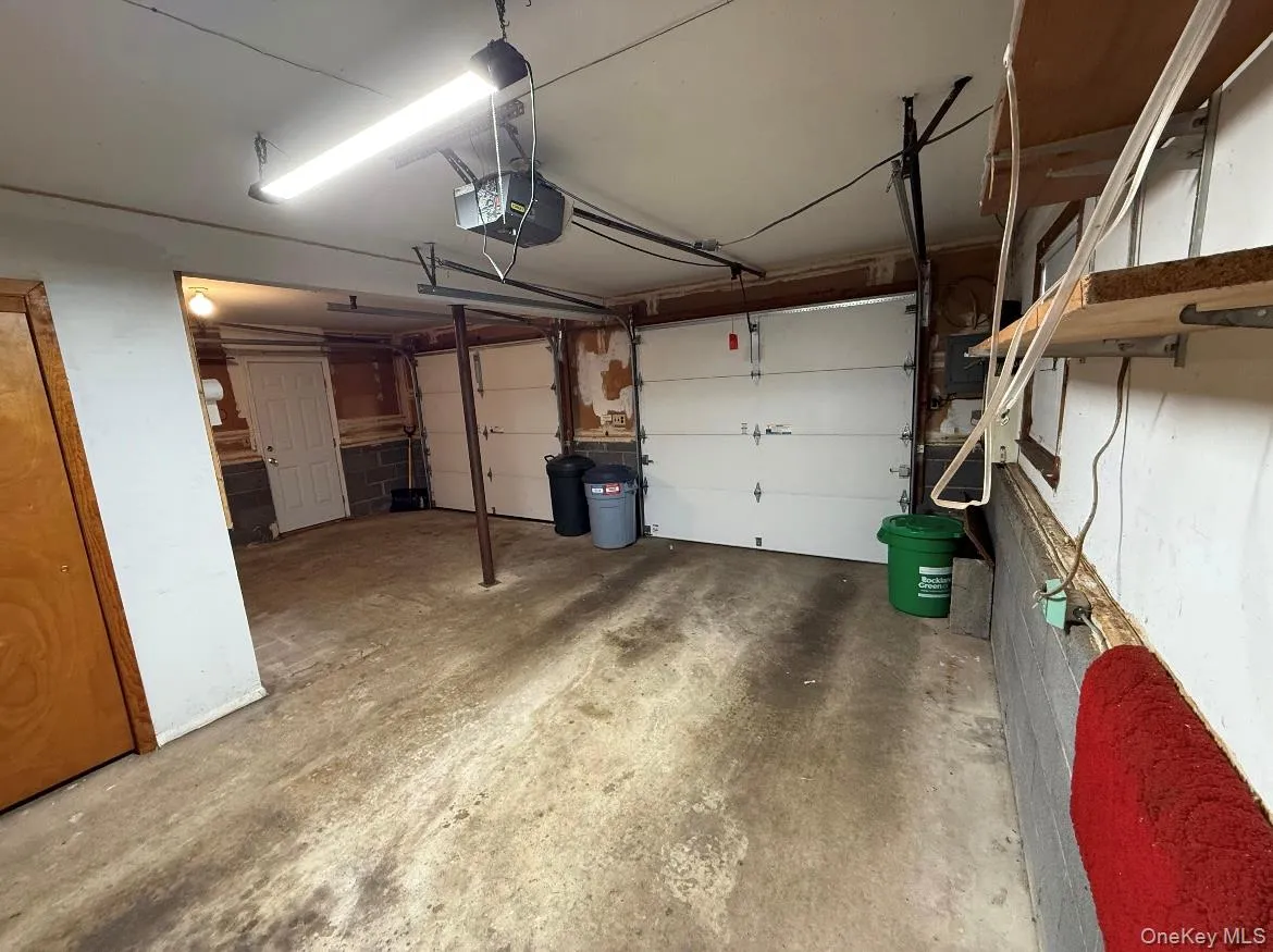 Garage featuring a garage door opener Garage featuring a garage door opener