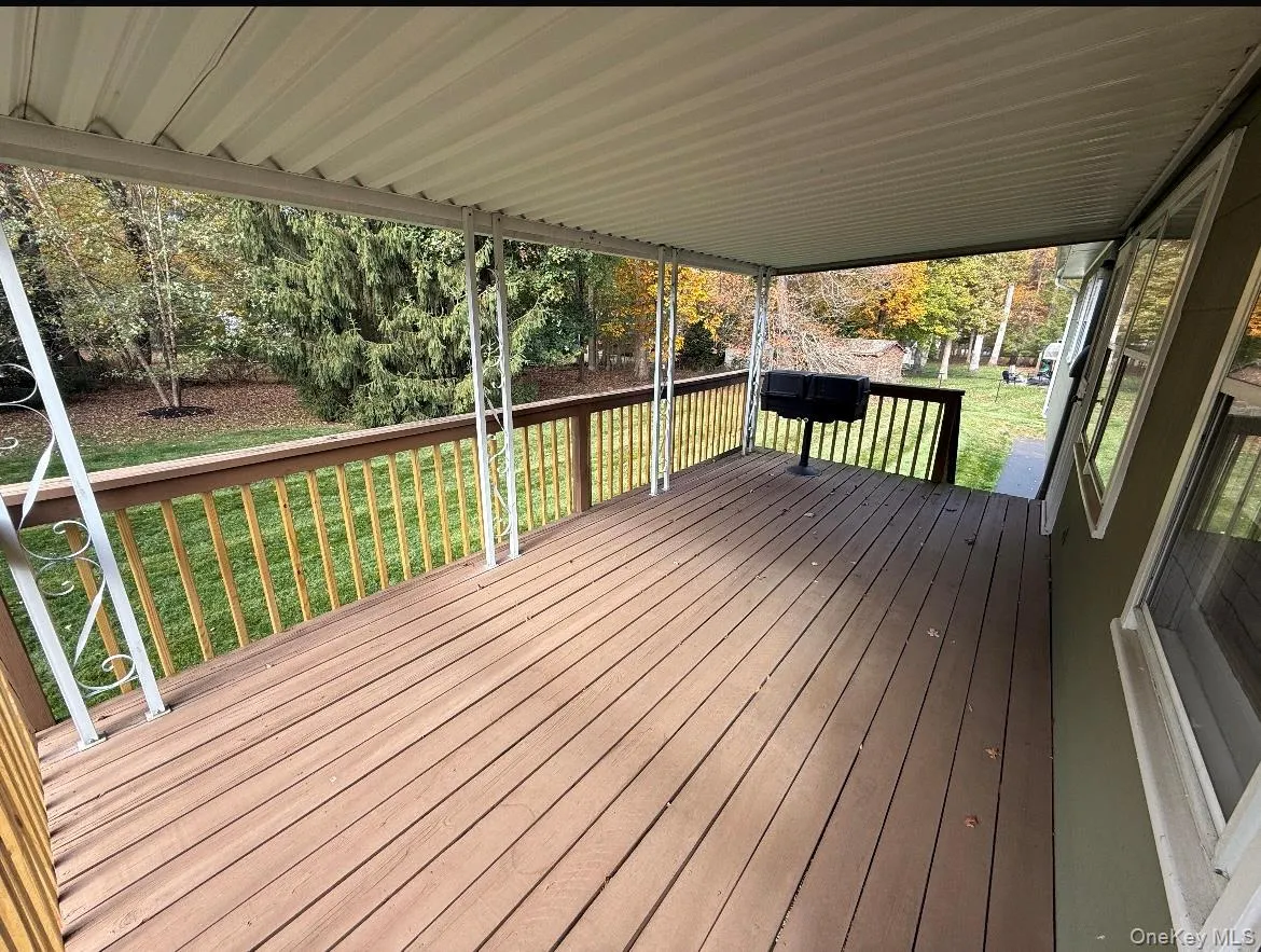 Wooden deck with a yard Wooden deck with a yard