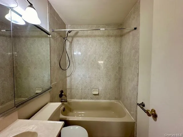 Full bathroom with vanity and washtub / shower combination Full bathroom with vanity and washtub / shower combination
