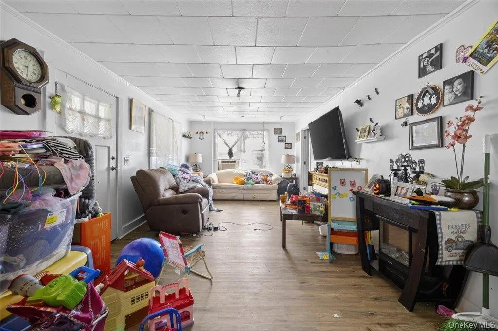 Playroom with wood finished floors and crown molding Playroom with wood finished floors and crown molding