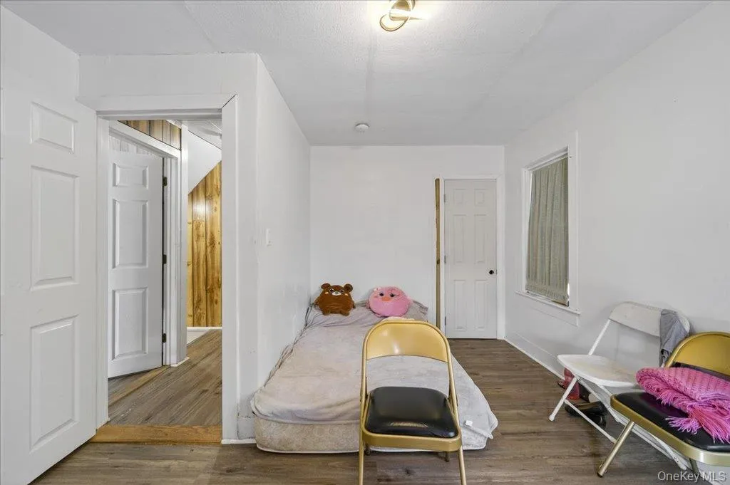 Bedroom with dark wood-type flooring Bedroom with dark wood-type flooring