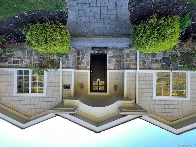 View of exterior entry with covered porch and stone siding View of exterior entry with covered porch and stone siding