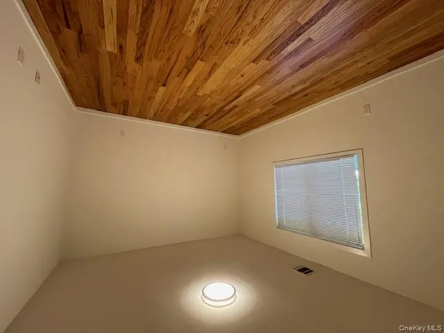 Bedroom 2 with light wood-style flooring and baseboards Bedroom 2 with light wood-style flooring and baseboards