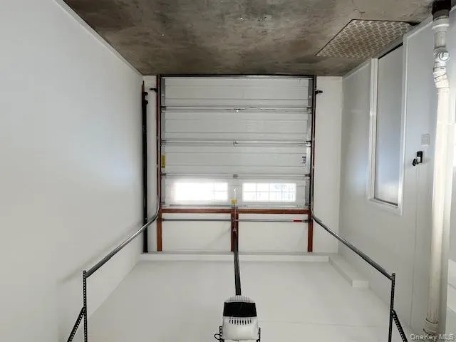 Garage featuring a garage door opener Garage featuring a garage door opener