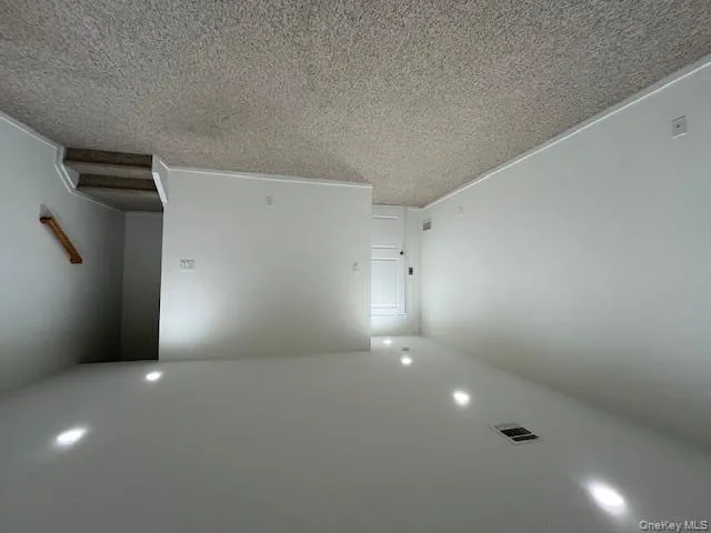Basement with carpet flooring and recessed lighting Basement with carpet flooring and recessed lighting