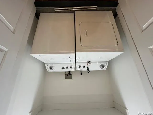 Laundry room featuring separate washer and dryer Laundry room featuring separate washer and dryer