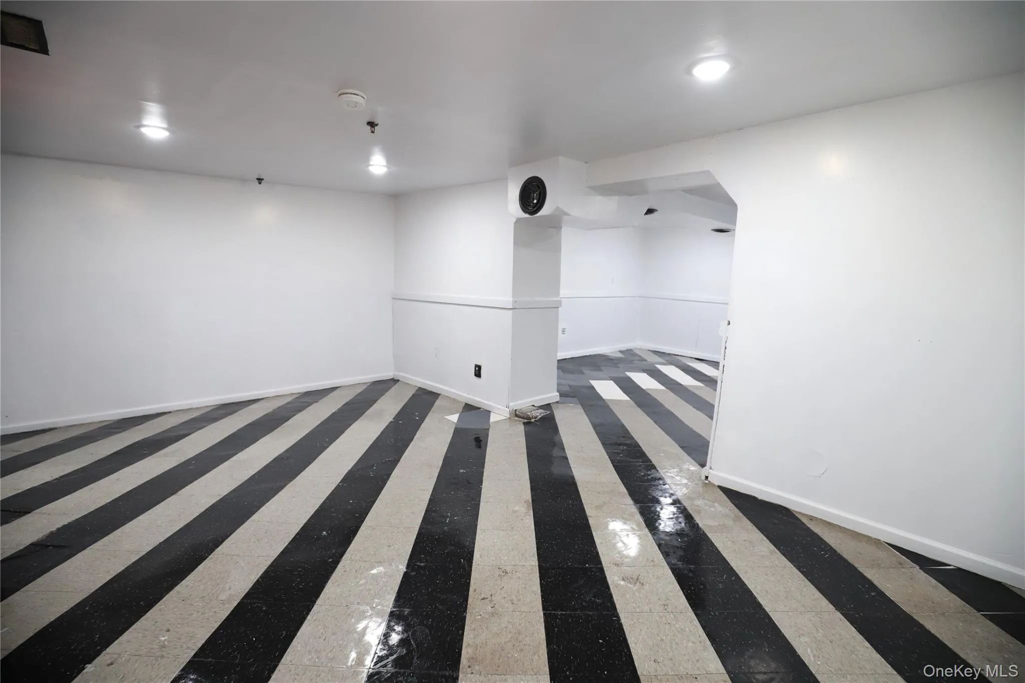 Empty room with baseboards and recessed lighting Empty room with baseboards and recessed lighting