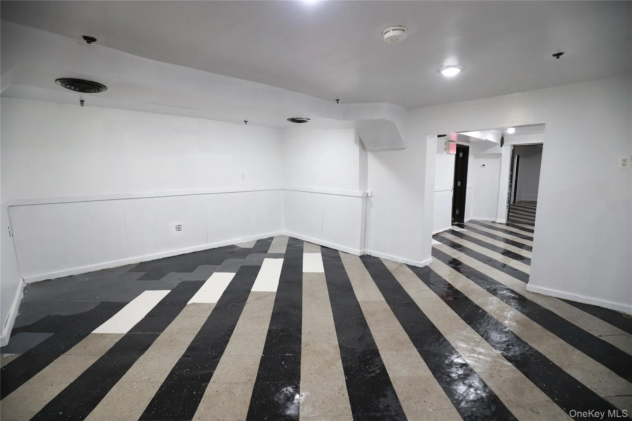 Empty room with baseboards Empty room with baseboards