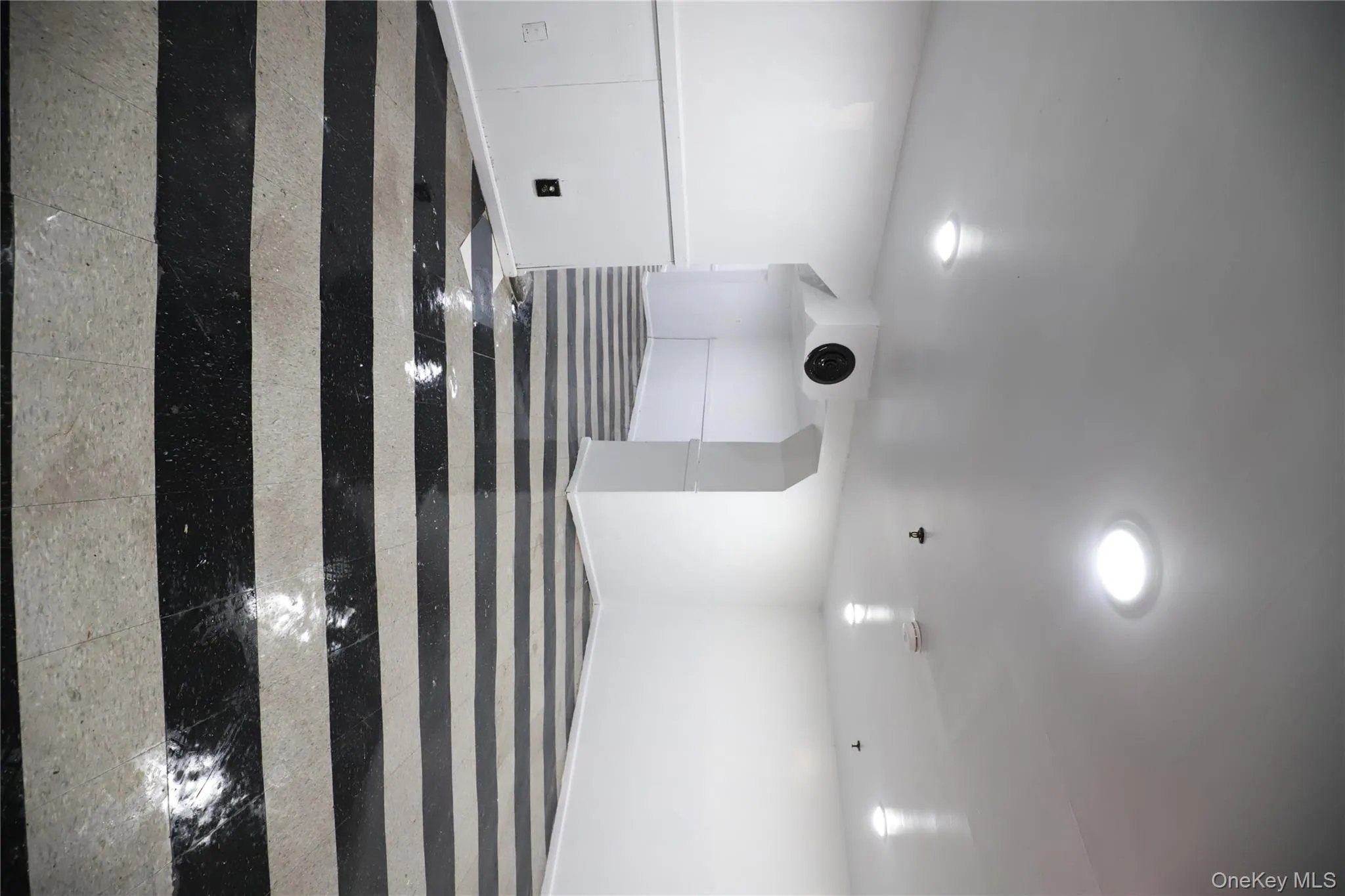 Unfurnished room featuring granite floors Unfurnished room featuring granite floors