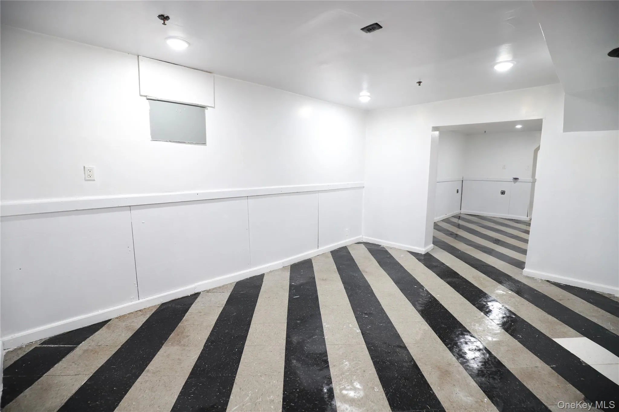 Unfurnished room with baseboards Unfurnished room with baseboards