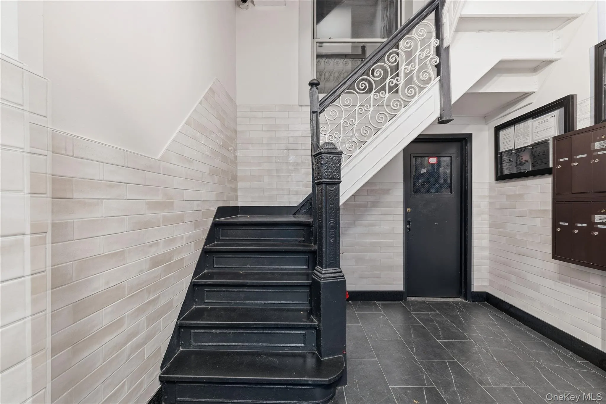 Stairs with tile walls and wainscoting Stairs with tile walls and wainscoting