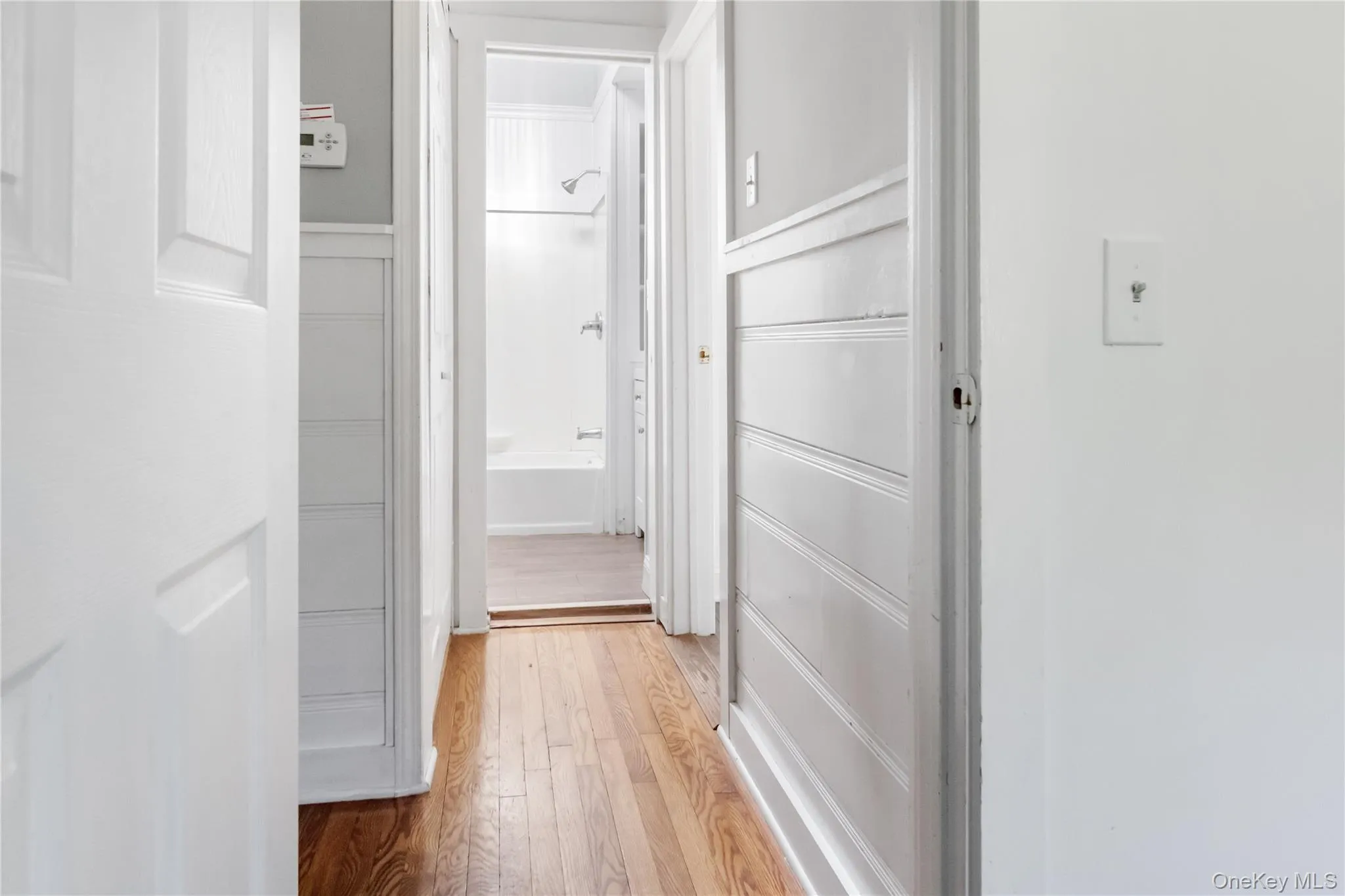 Corridor with light wood-style flooring Corridor with light wood-style flooring