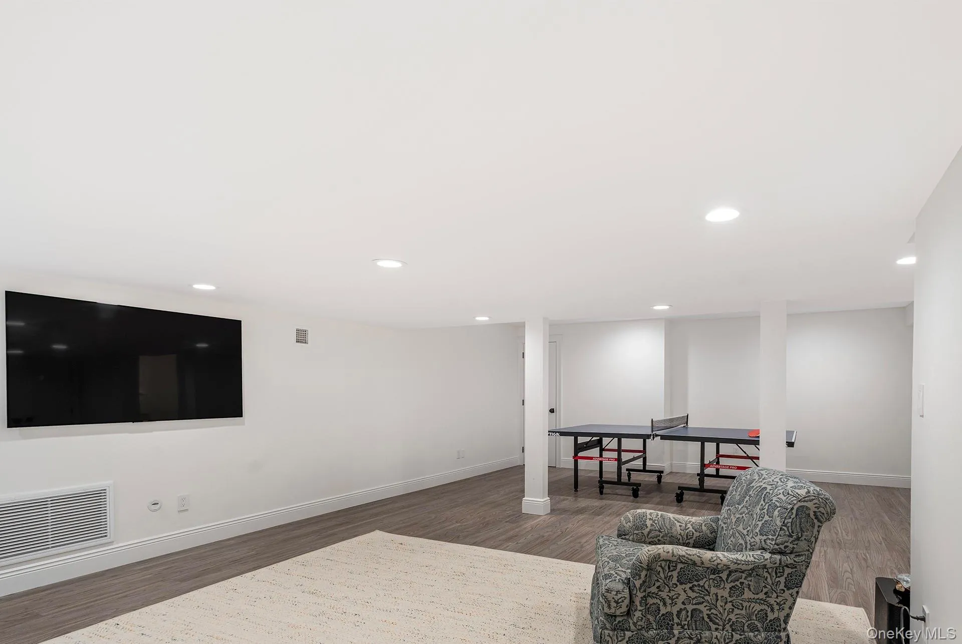 Recreation room with recessed lighting and wood finished floors Recreation room with recessed lighting and wood finished floors