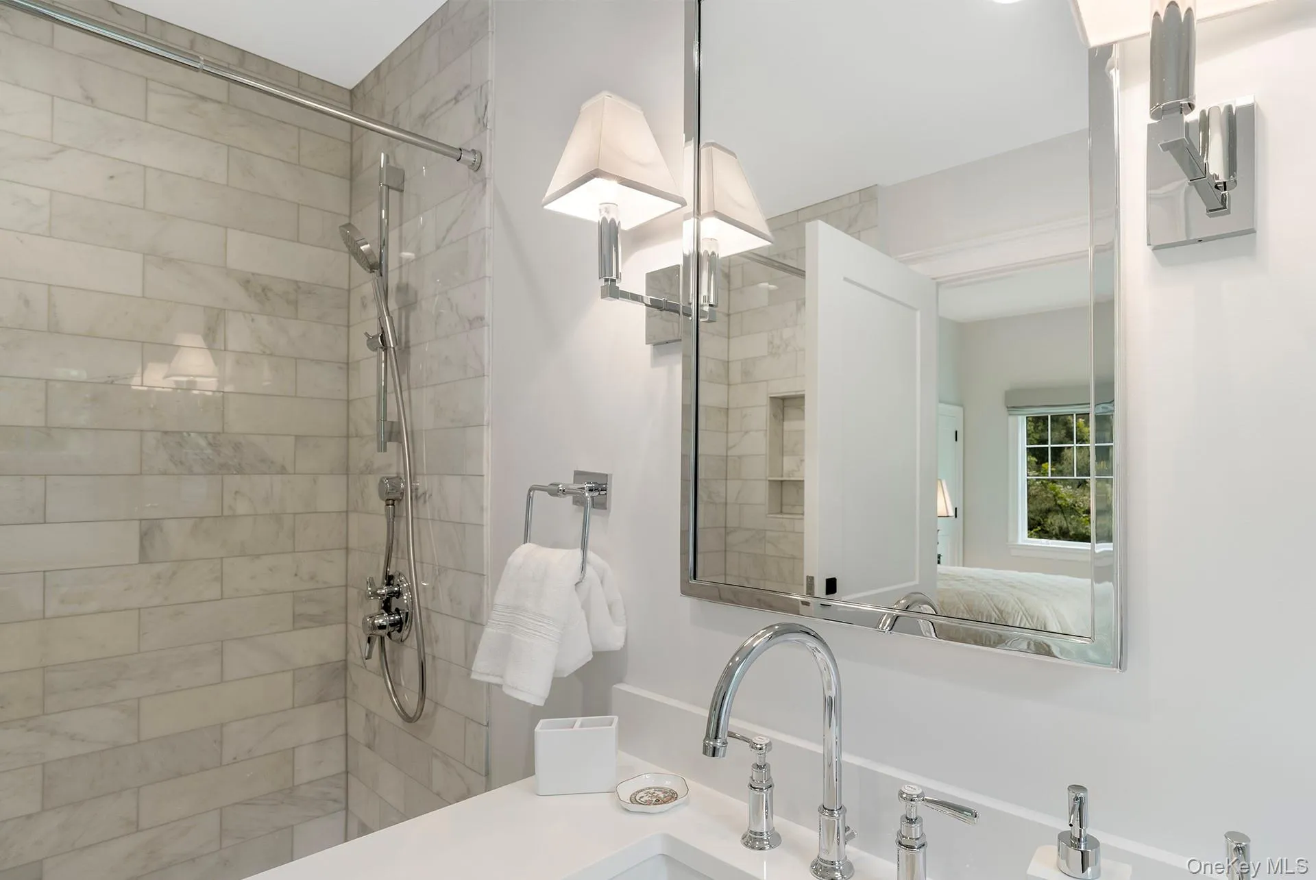 Ensuite bathroom featuring vanity and a tile shower Ensuite bathroom featuring vanity and a tile shower