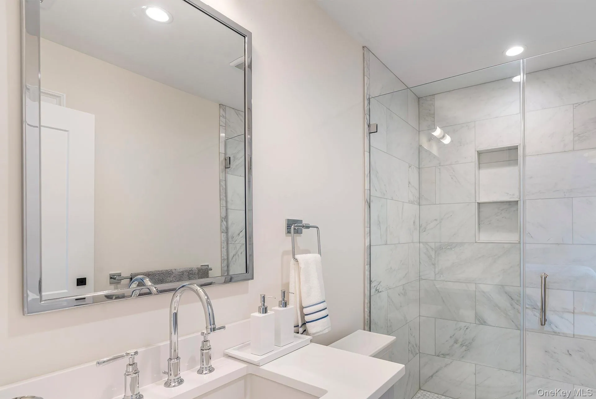 Bathroom featuring vanity, a shower stall, and recessed lighting Bathroom featuring vanity, a shower stall, and recessed lighting