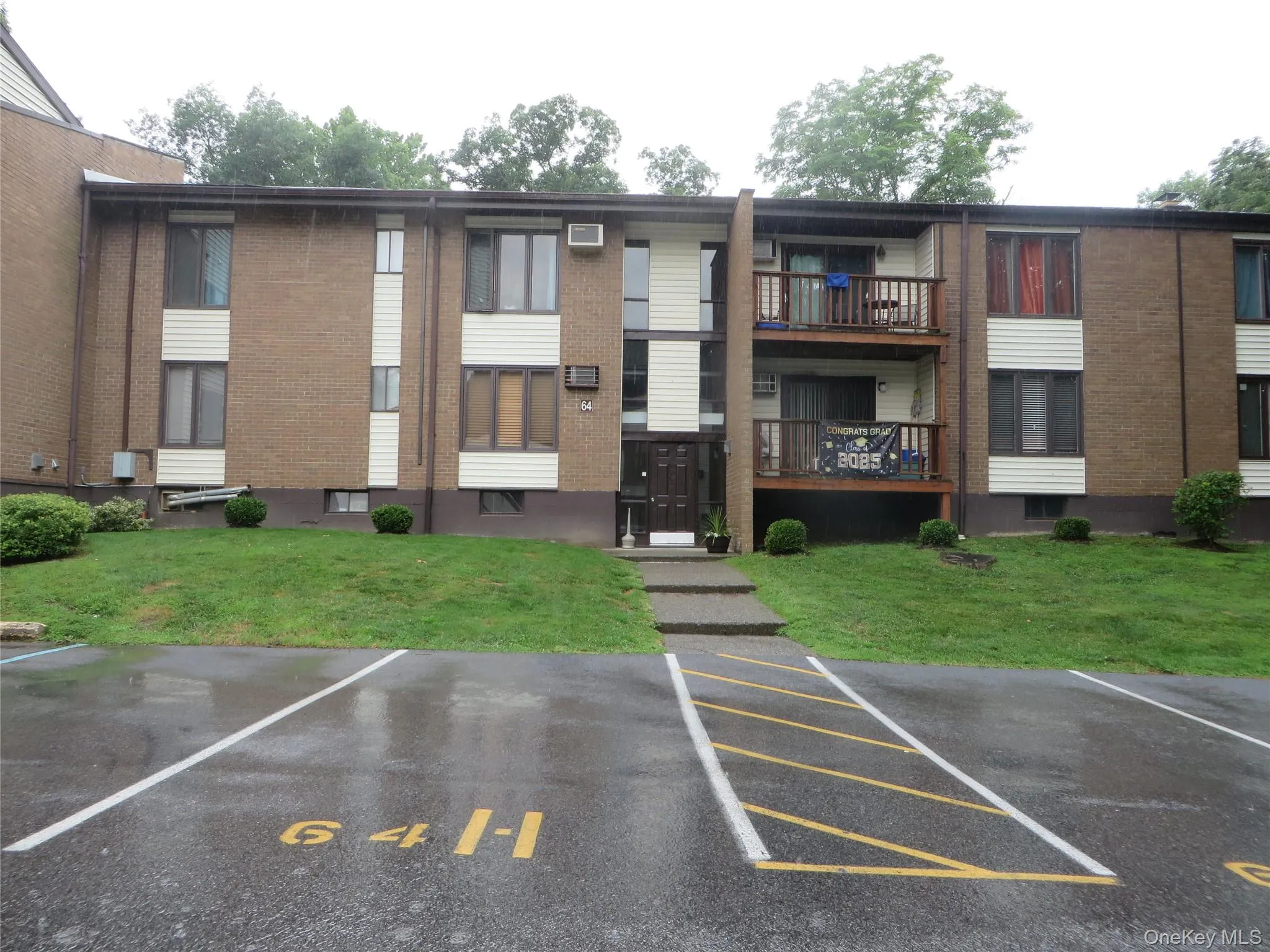 View of property featuring uncovered parking View of property featuring uncovered parking