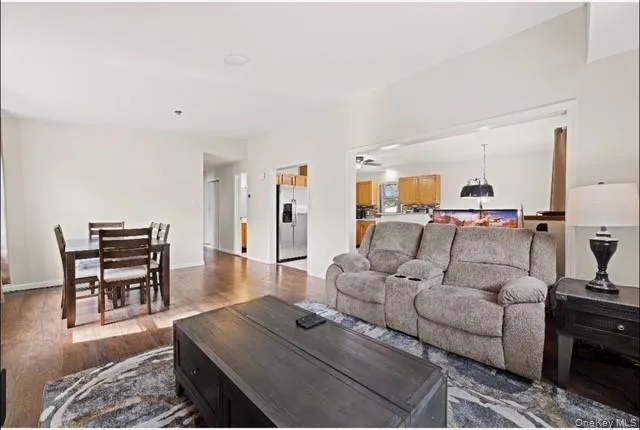 Living area featuring dark wood-style flooring Living area featuring dark wood-style flooring