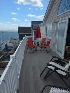 Balcony with a water view and a sunroom Balcony with a water view and a sunroom