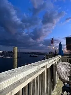 Balcony at dusk with a water view Balcony at dusk with a water view