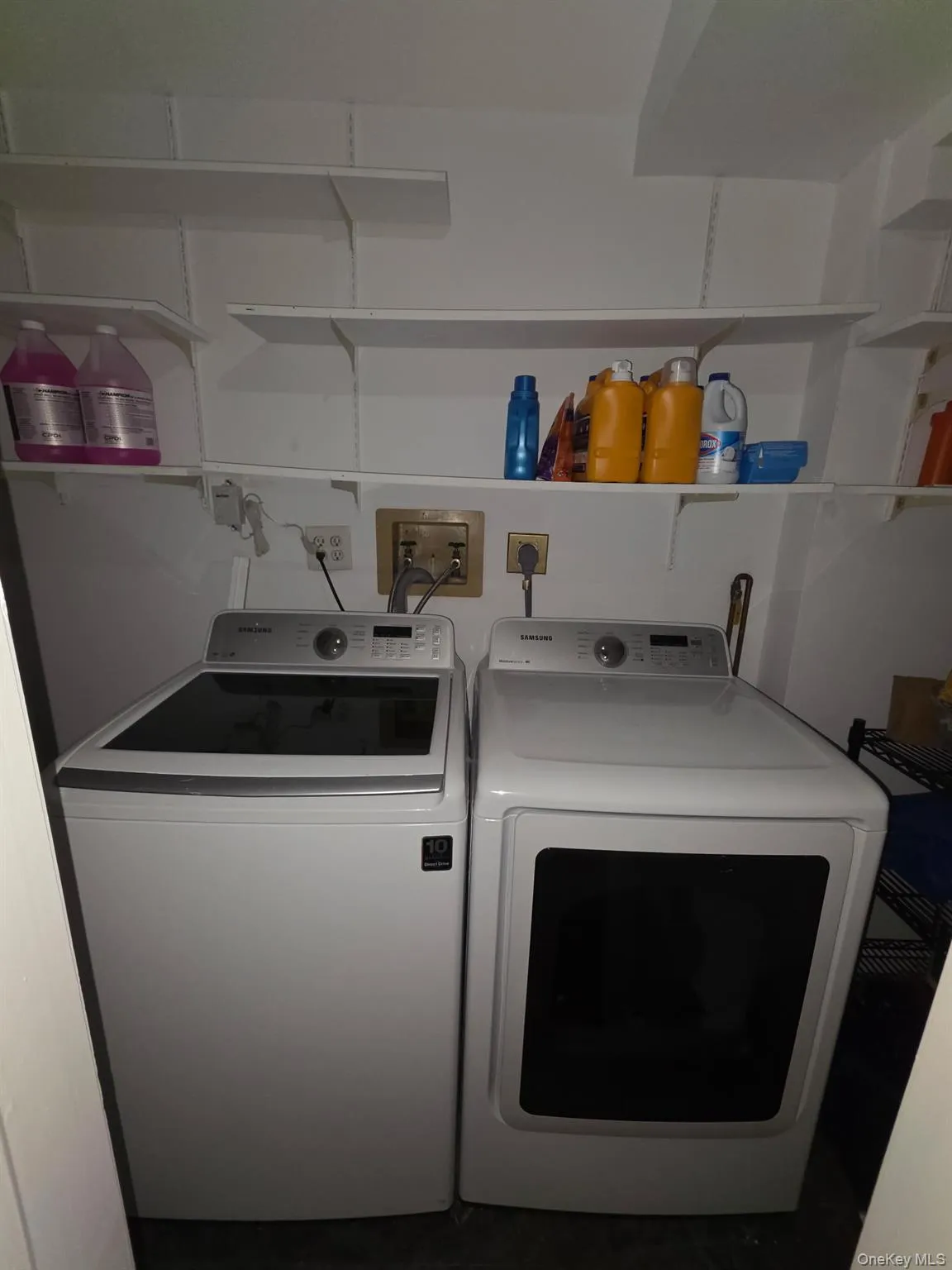 Washroom featuring washing machine and clothes dryer Washroom featuring washing machine and clothes dryer