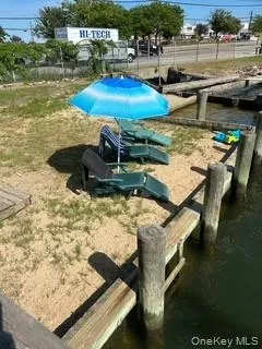View of swimming pool featuring a dock View of swimming pool featuring a dock