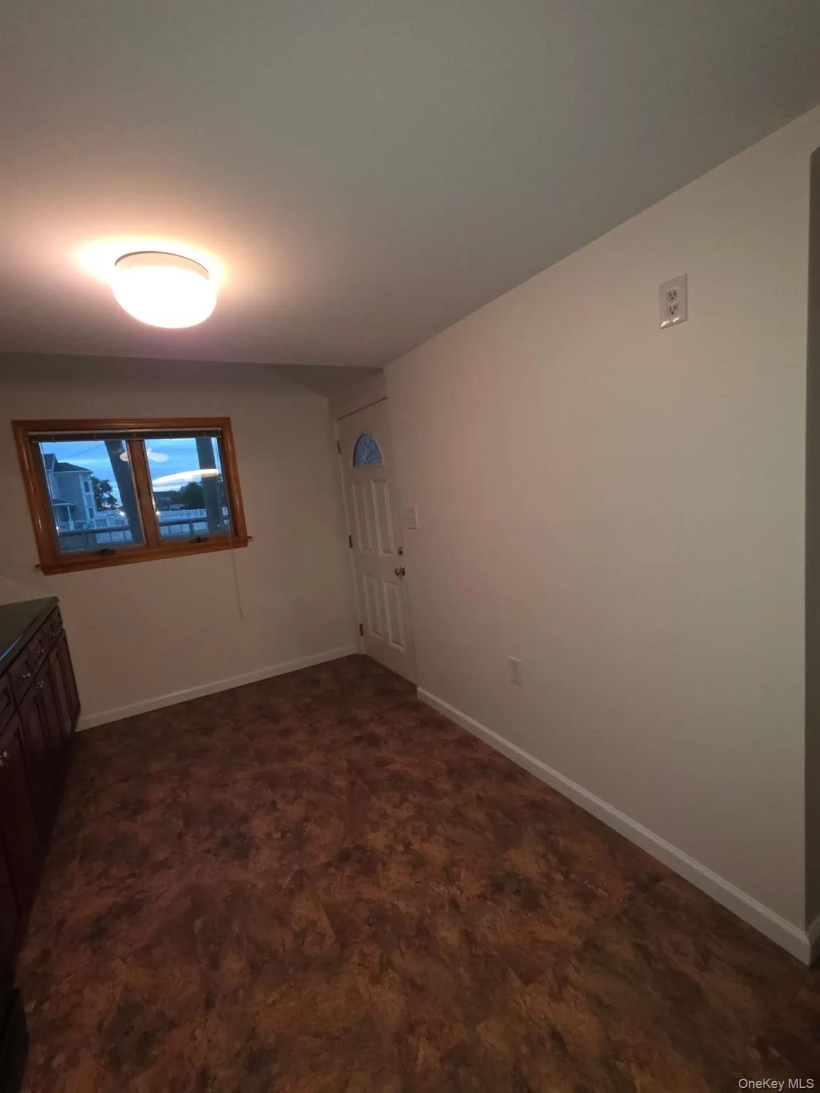 Empty room with baseboards Empty room with baseboards