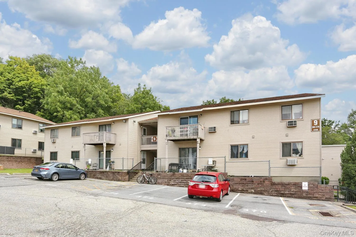 View of property featuring uncovered parking View of property featuring uncovered parking