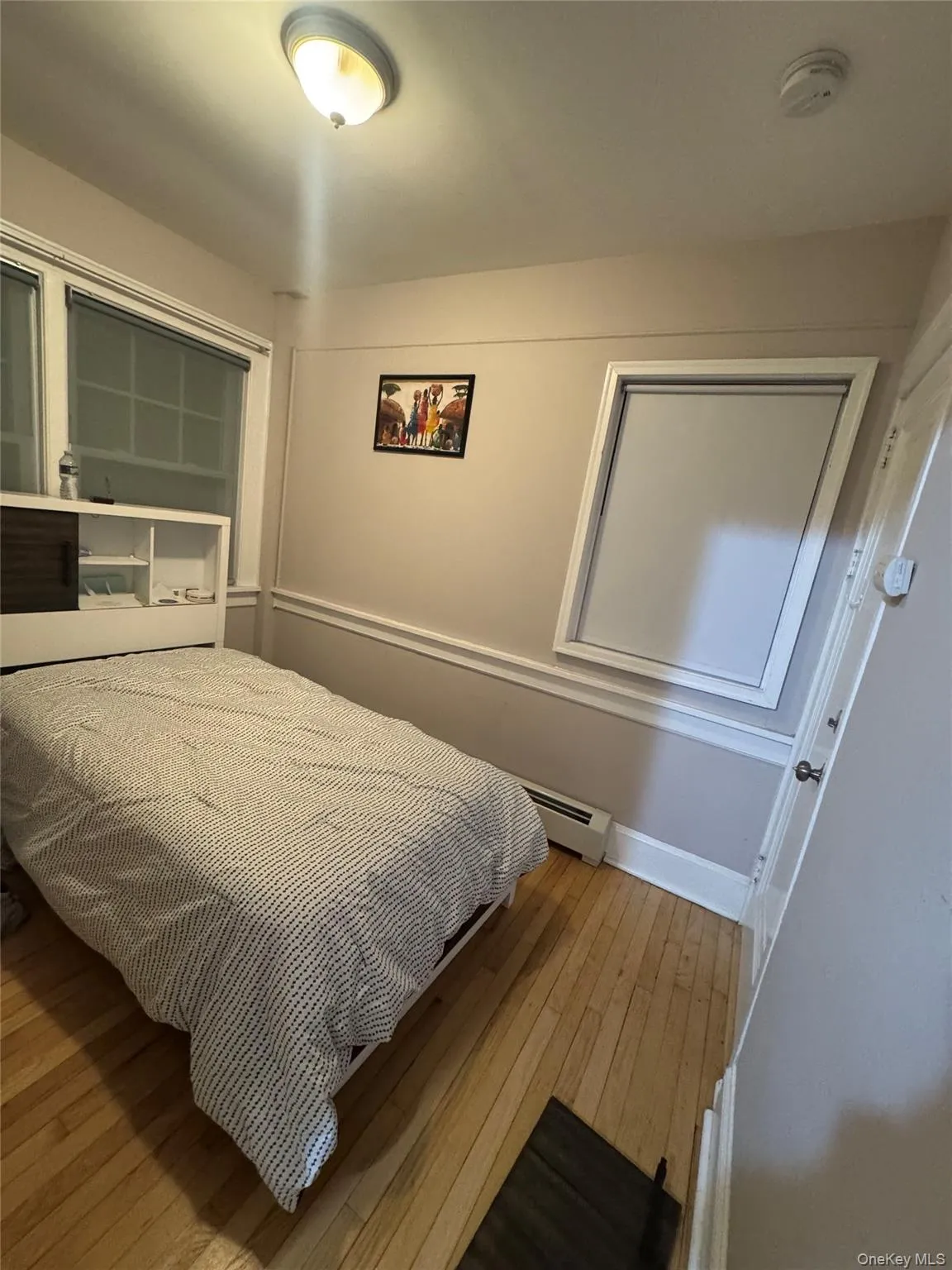 Bedroom featuring light wood-style floors Bedroom featuring light wood-style floors
