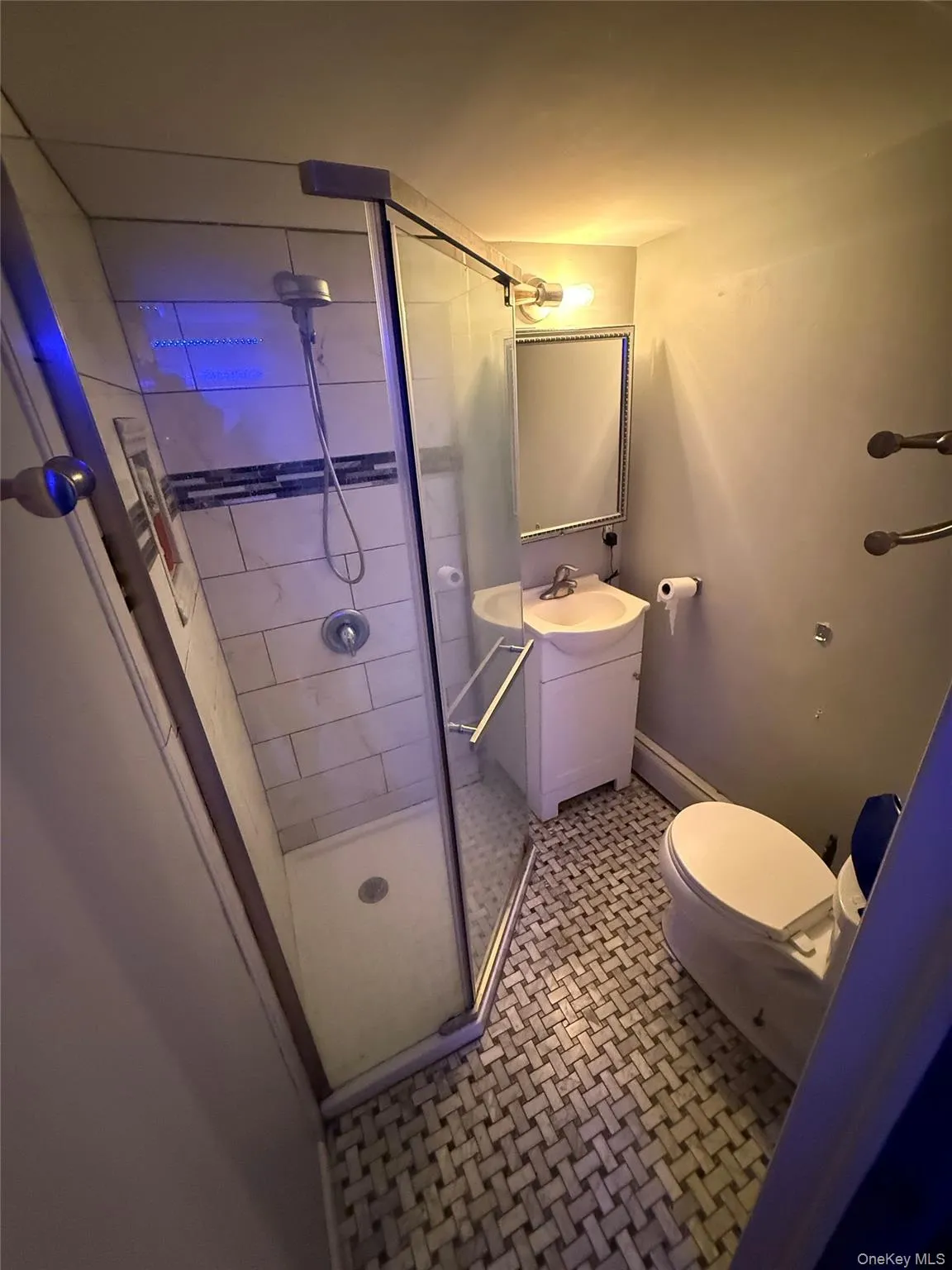 Bathroom featuring vanity and a shower stall Bathroom featuring vanity and a shower stall