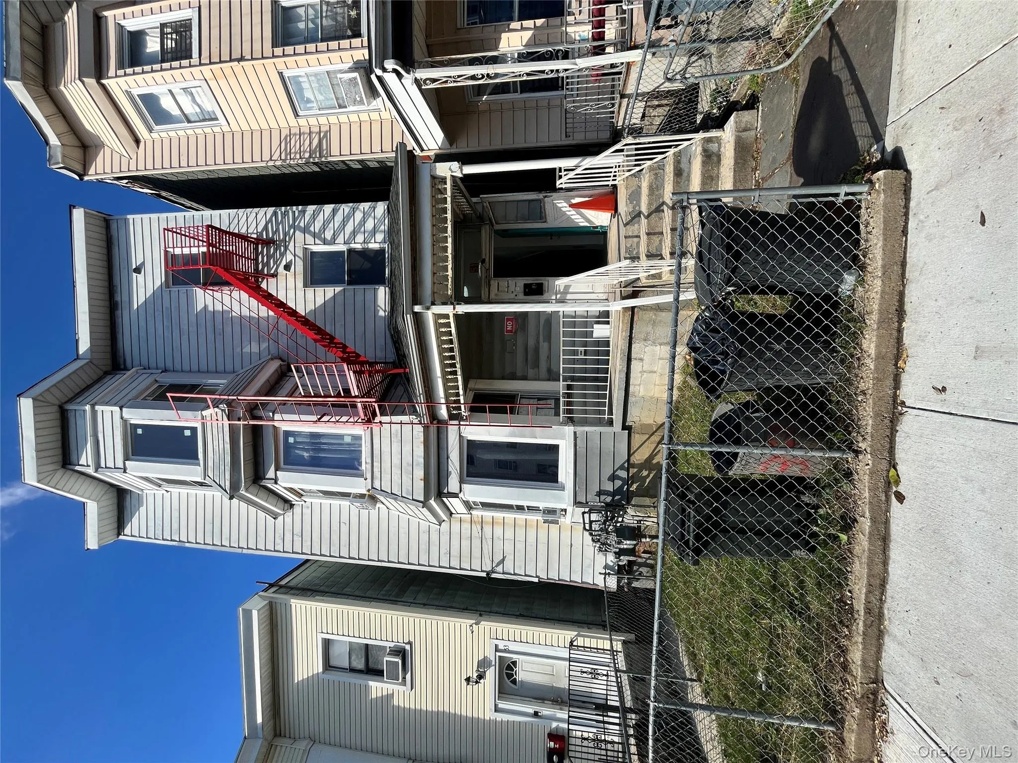 View of front facade featuring a fenced front yard and a porch View of front facade featuring a fenced front yard and a porch