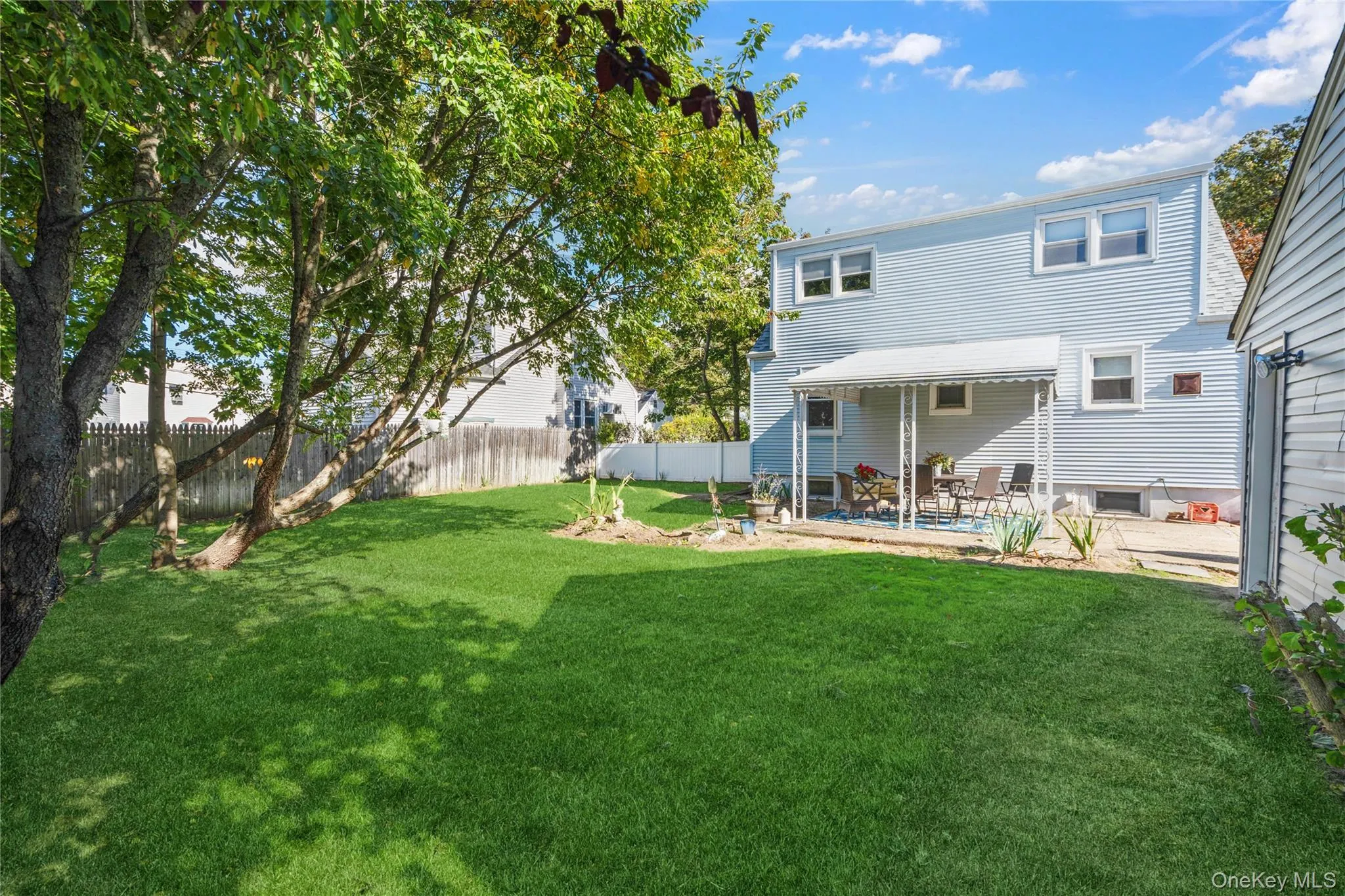 Back of house featuring a fenced backyard and a deck Back of house featuring a fenced backyard and a deck