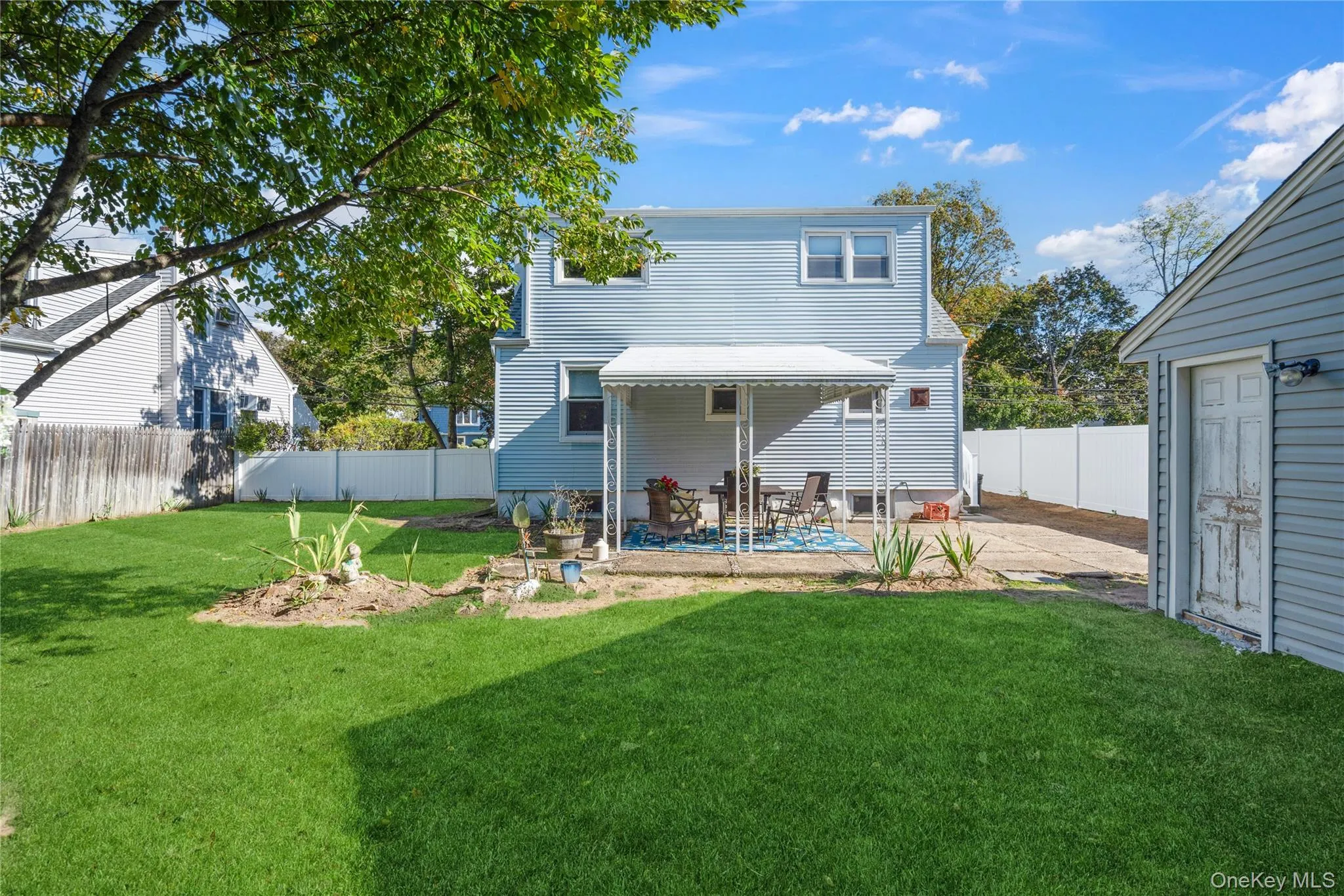 Rear view of property featuring a patio and a fenced backyard Rear view of property featuring a patio and a fenced backyard