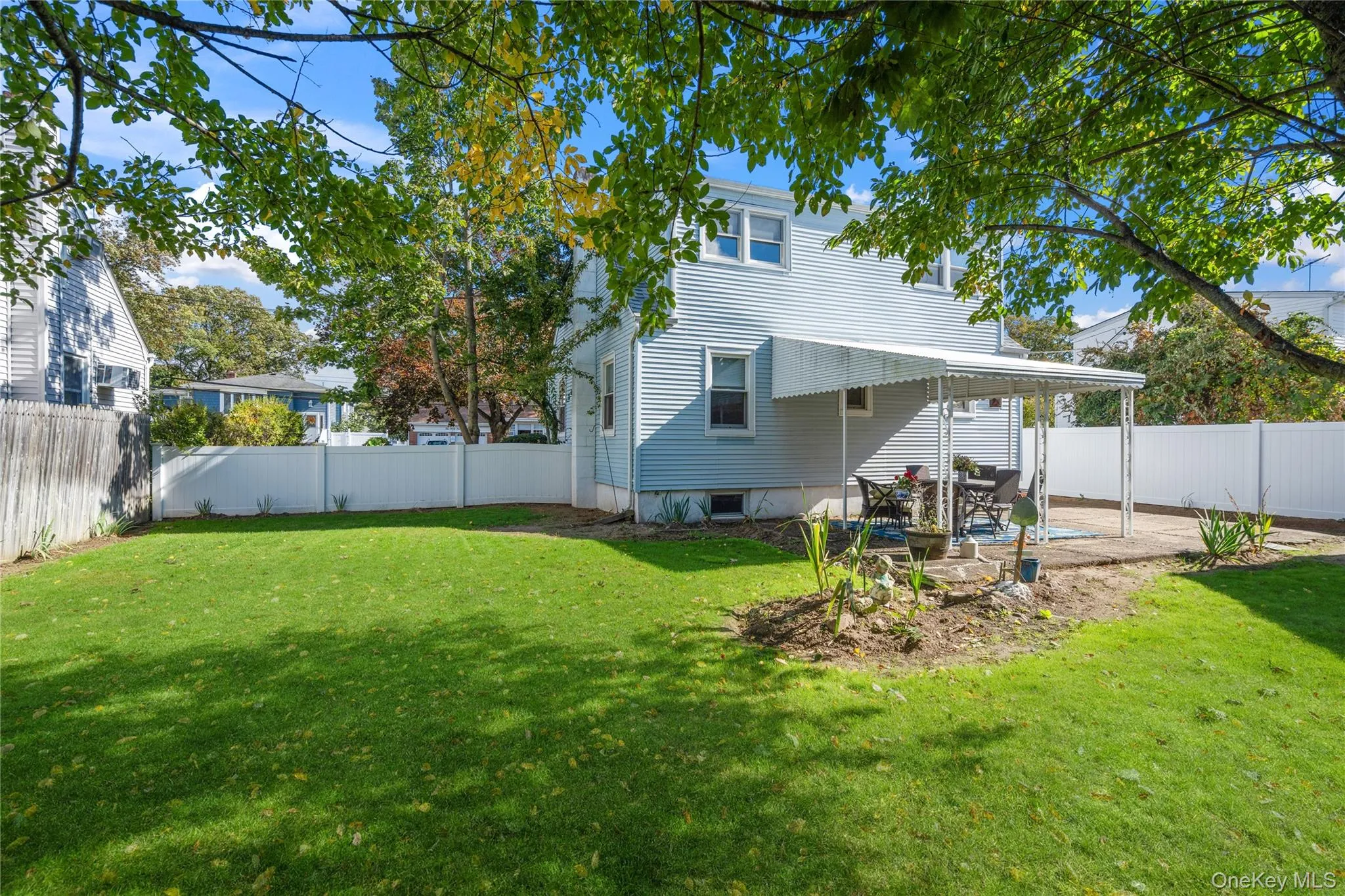 Rear view of property with a fenced backyard and a patio area Rear view of property with a fenced backyard and a patio area
