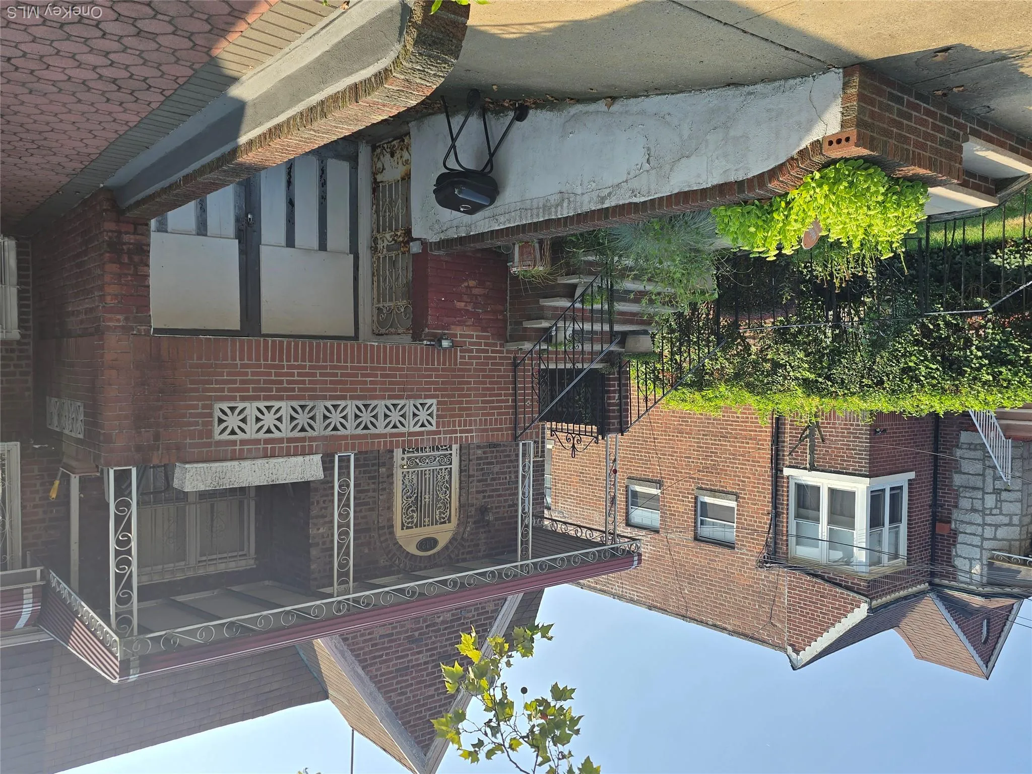 View of front of house with brick siding, stairway, and a porch View of front of house with brick siding, stairway, and a porch