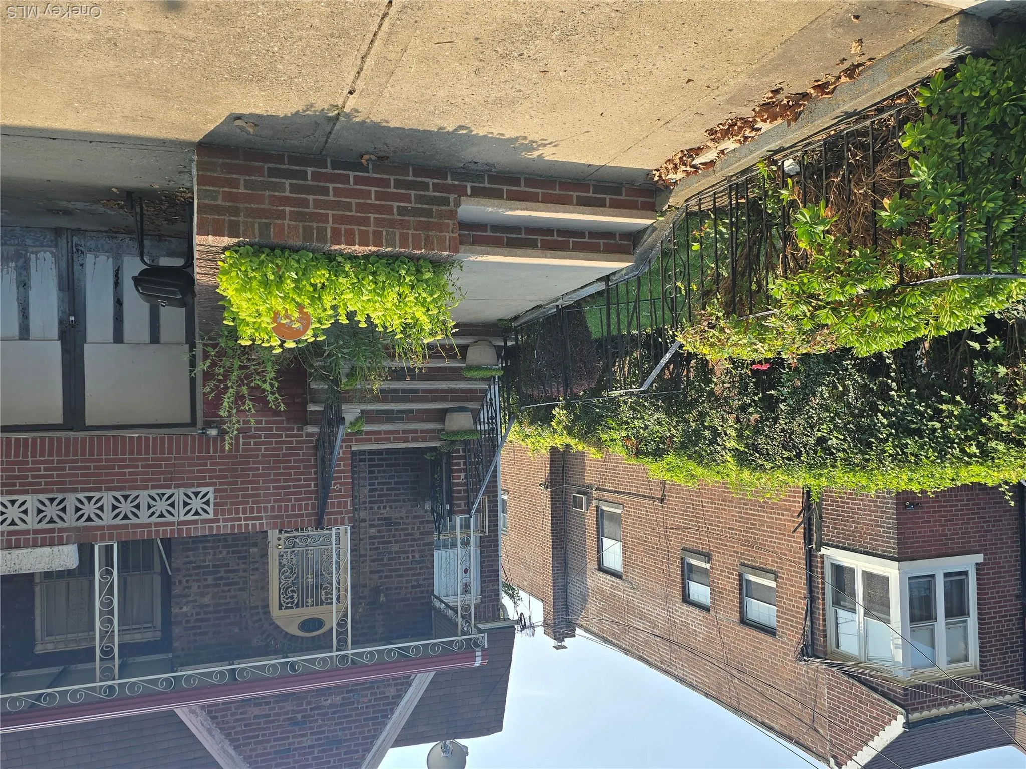 Doorway to property with brick siding and covered porch Doorway to property with brick siding and covered porch