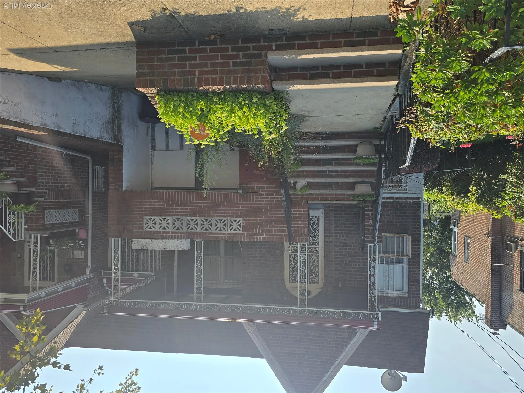 View of front of house with a porch and brick siding View of front of house with a porch and brick siding