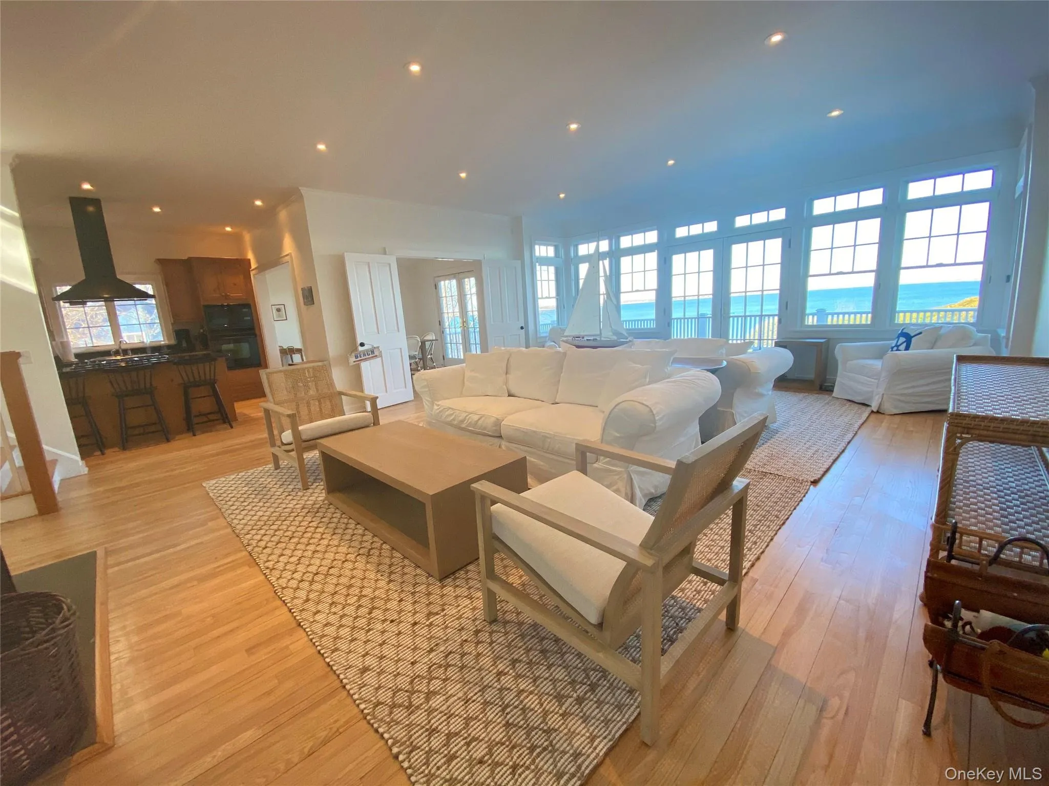 Living room with recessed lighting and light wood-style flooring Living room with recessed lighting and light wood-style flooring