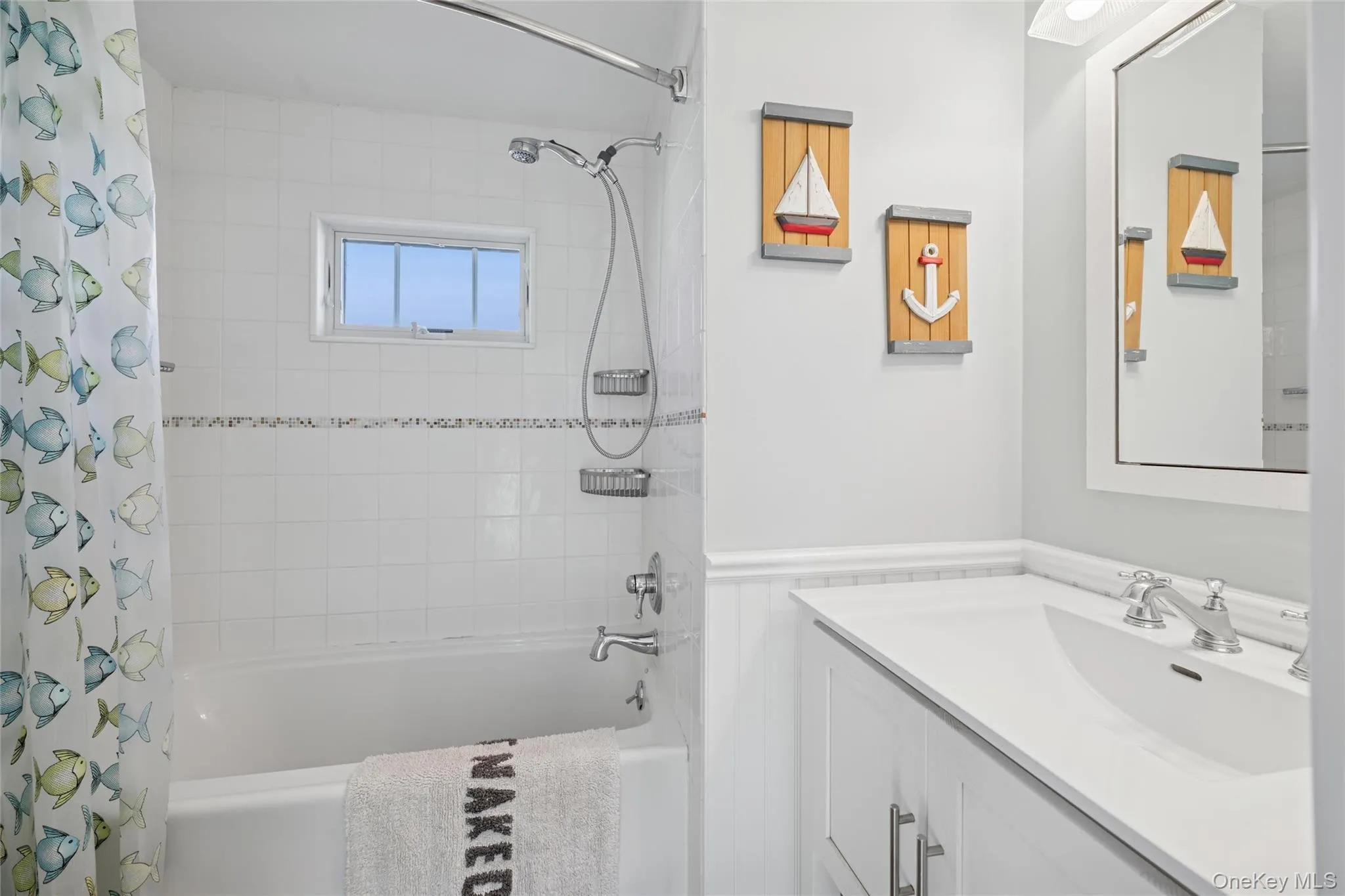 Full bath featuring shower / tub combo with curtain and vanity Full bath featuring shower / tub combo with curtain and vanity