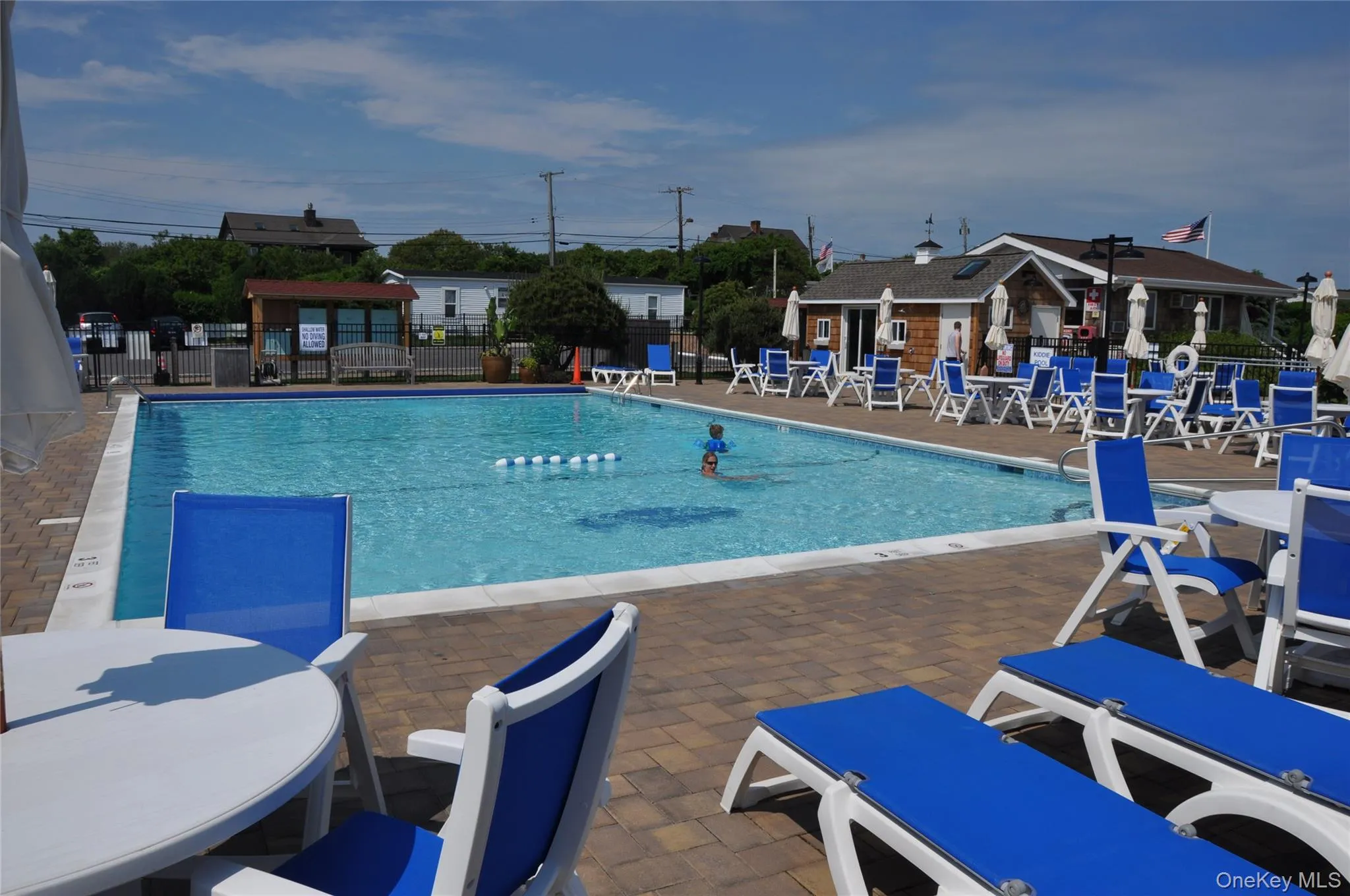 Community pool with a patio Community pool with a patio