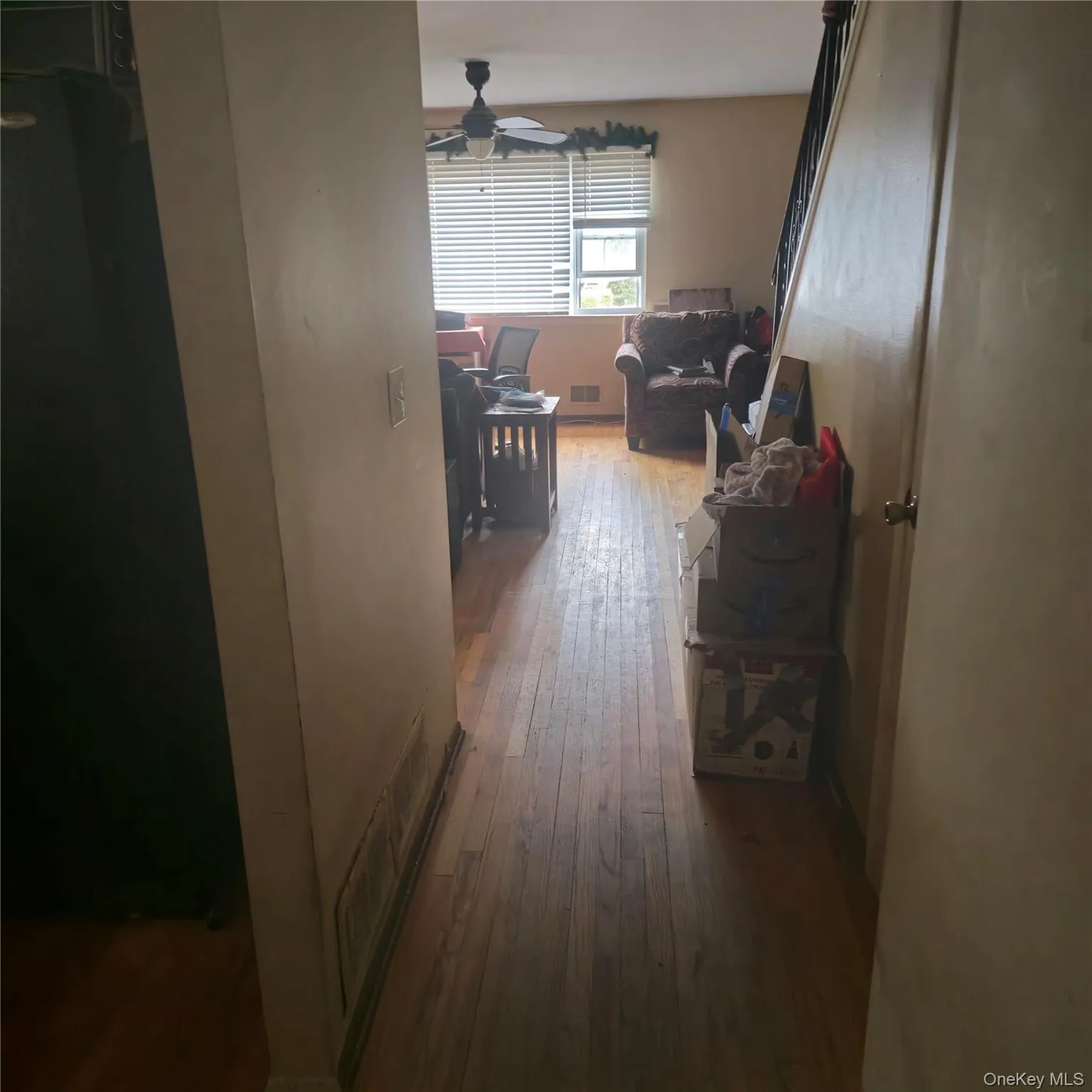 Hallway with hardwood / wood-style flooring Hallway with hardwood / wood-style flooring