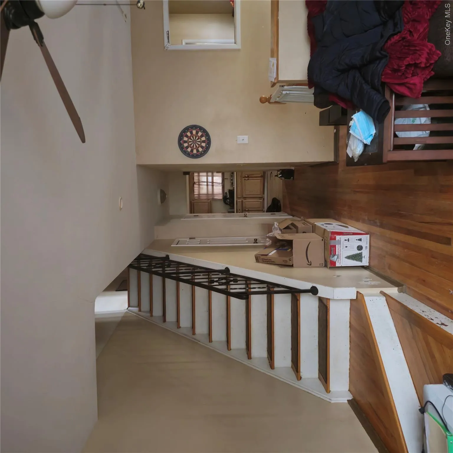 Staircase featuring wood finished floors and ceiling fan Staircase featuring wood finished floors and ceiling fan