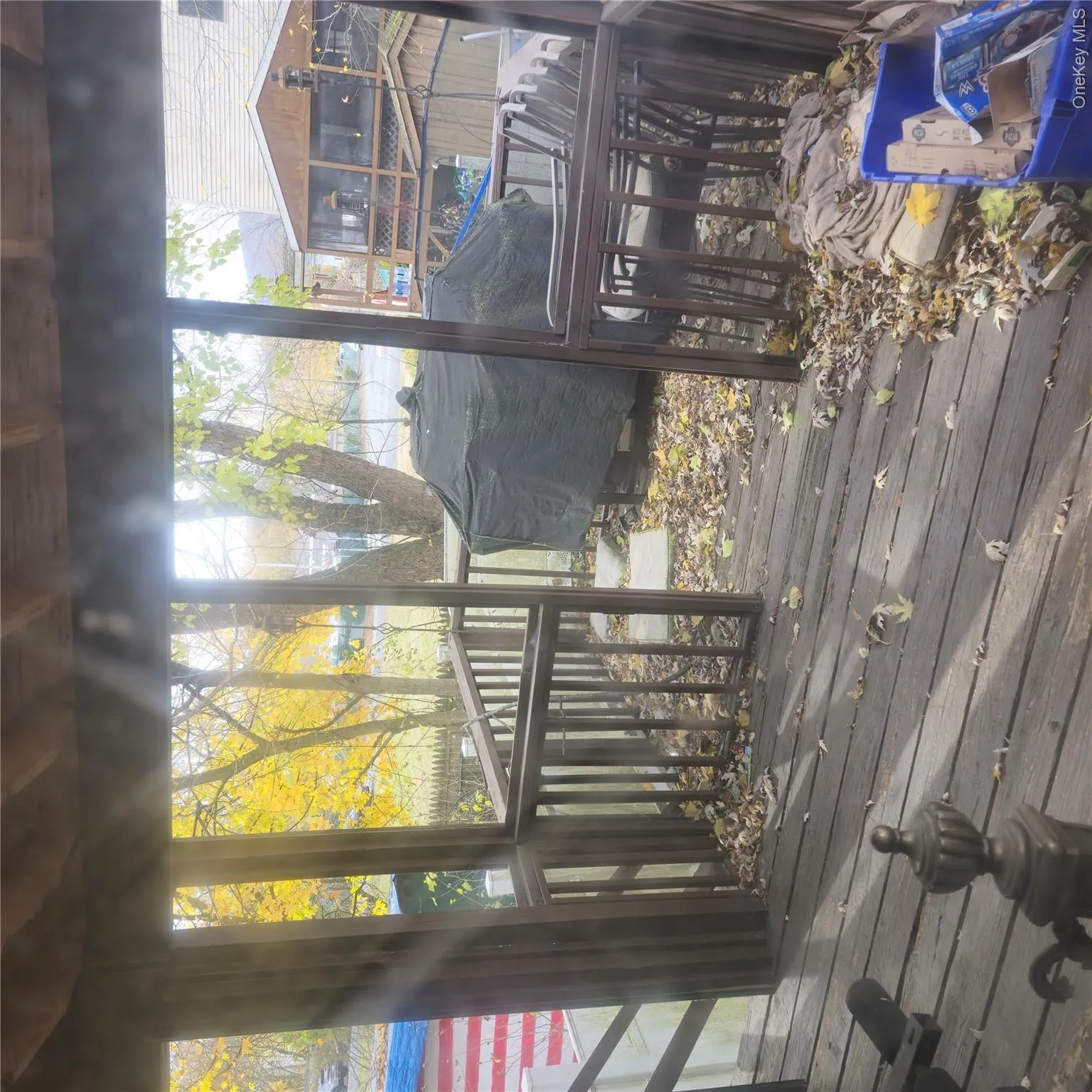 Wooden deck with a grill Wooden deck with a grill