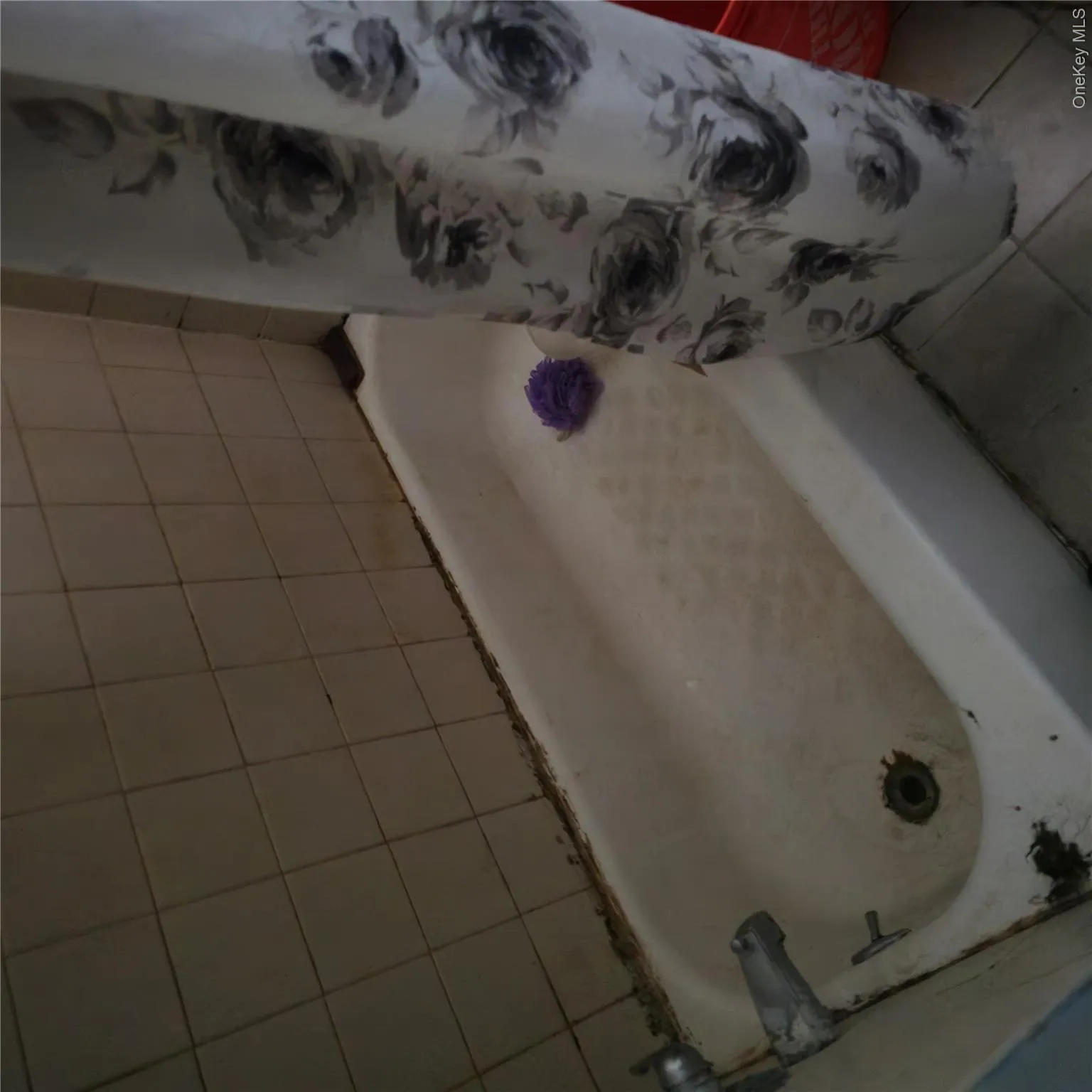 Bathroom with tile patterned walls and tub Bathroom with tile patterned walls and tub