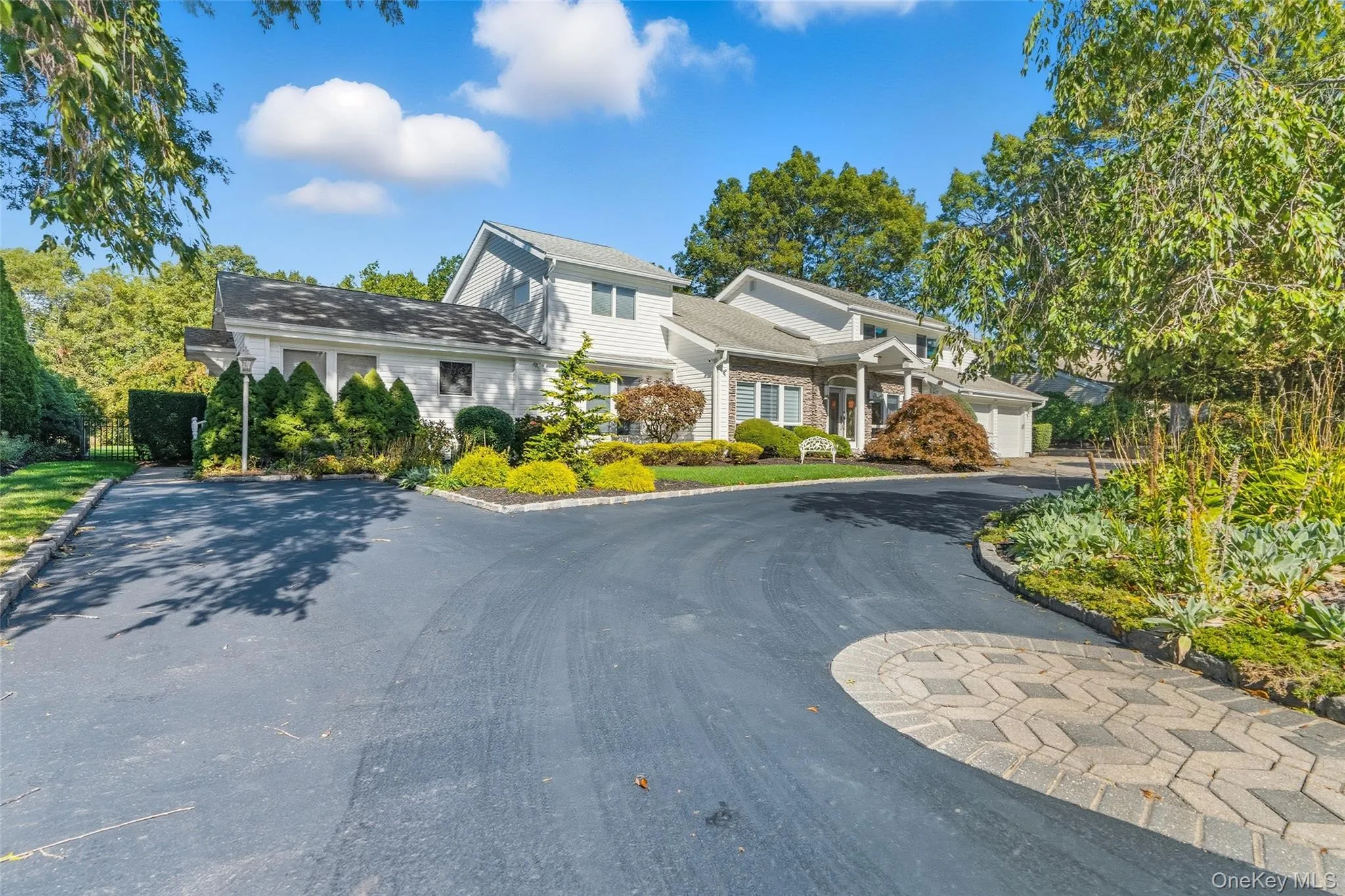 View of front of home with a garage and asphalt driveway View of front of home with a garage and asphalt driveway