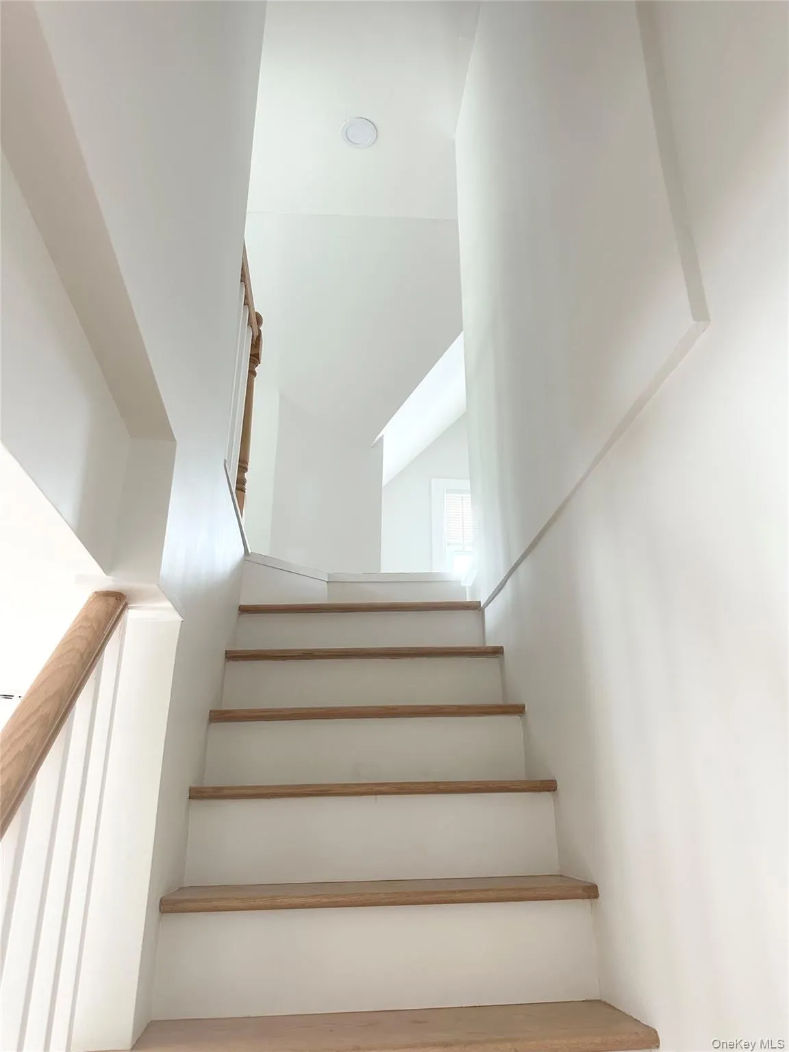 View of stairs to upper level. View of stairs to upper level.