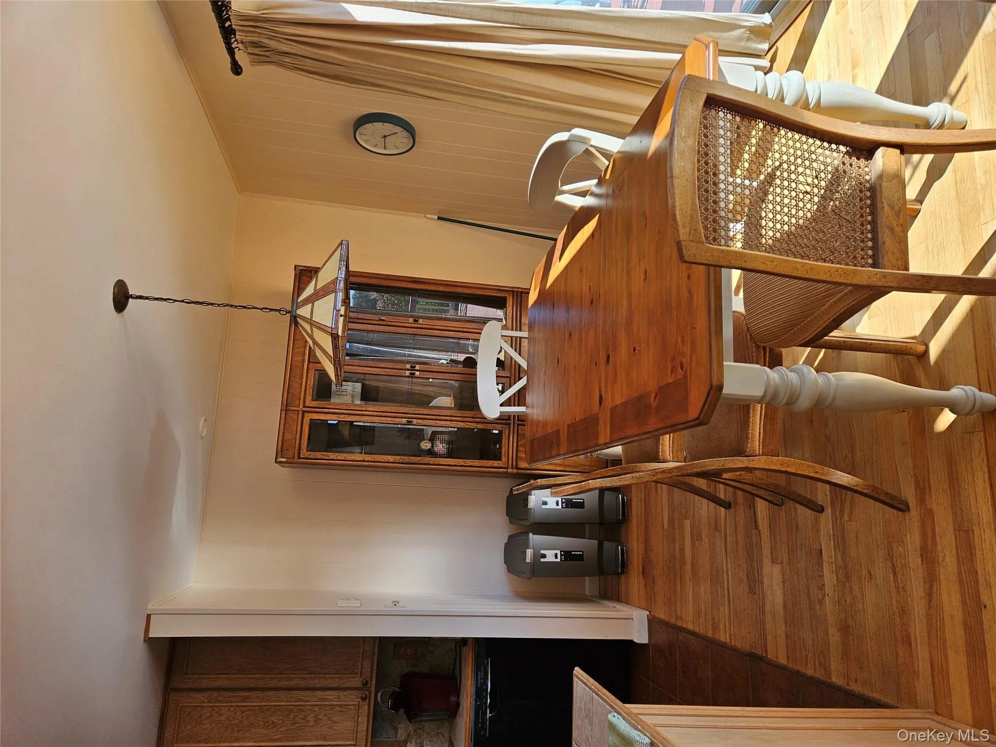 Dining area featuring wood finished floors and wooden walls Dining area featuring wood finished floors and wooden walls