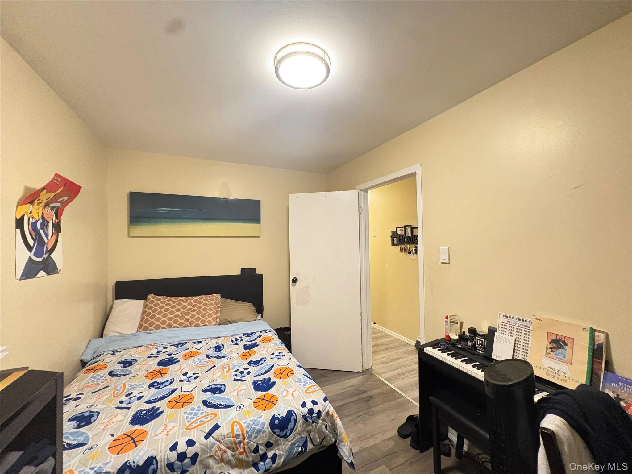 Bedroom with dark wood finished floors Bedroom with dark wood finished floors