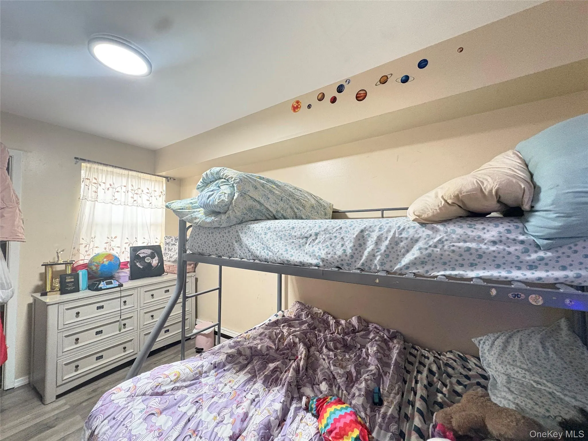 Bedroom with wood finished floors Bedroom with wood finished floors