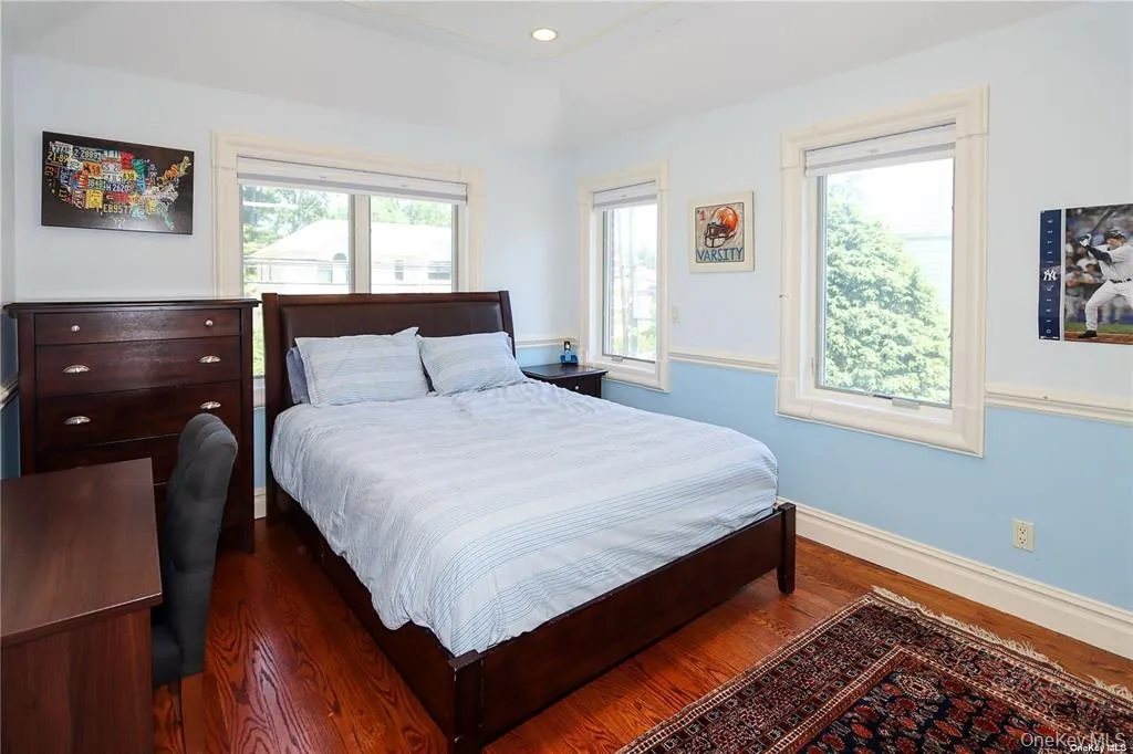 Bedroom with wood finished floors and recessed lighting Bedroom with wood finished floors and recessed lighting