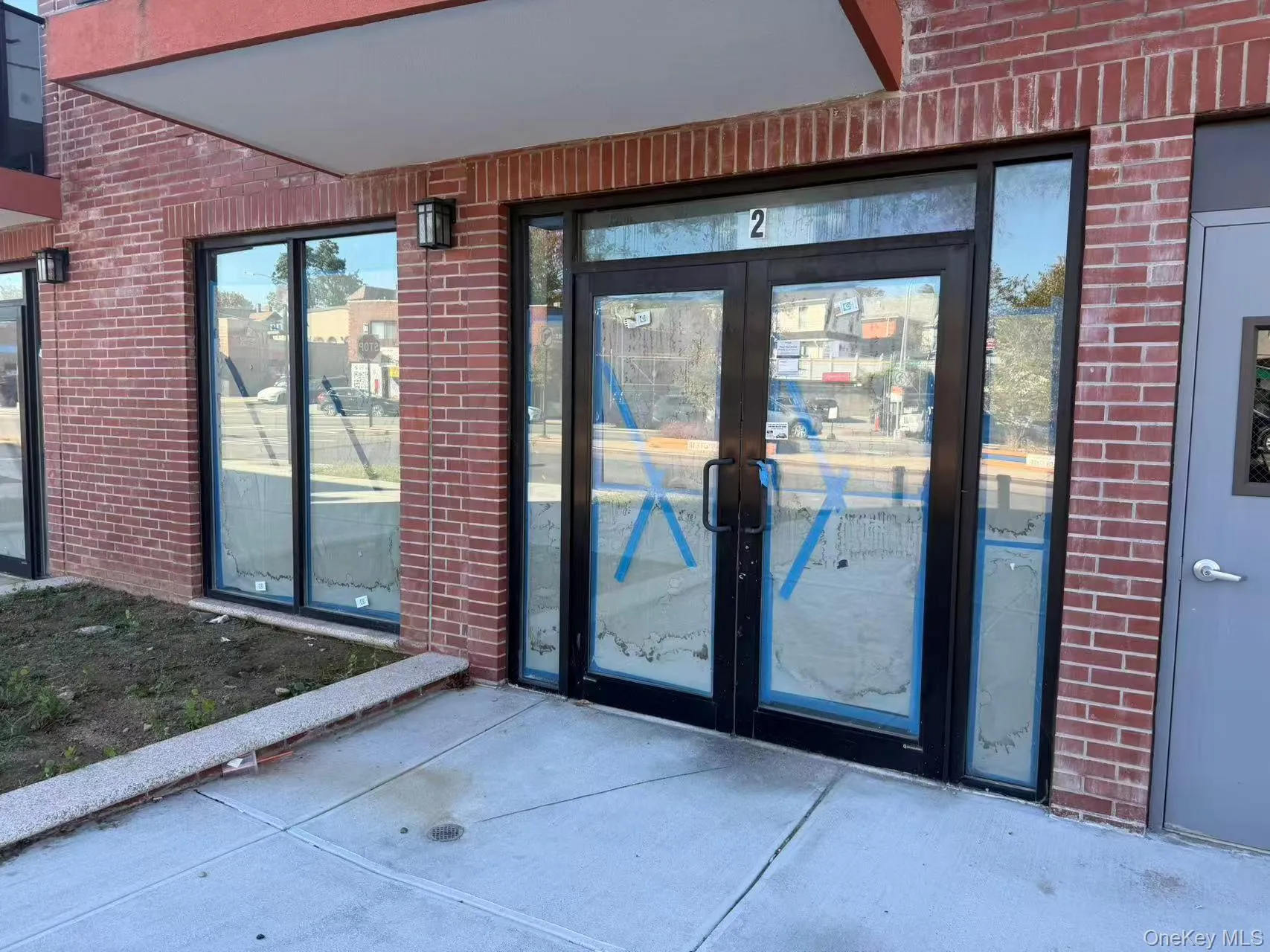 Property entrance featuring brick siding and french doors Property entrance featuring brick siding and french doors